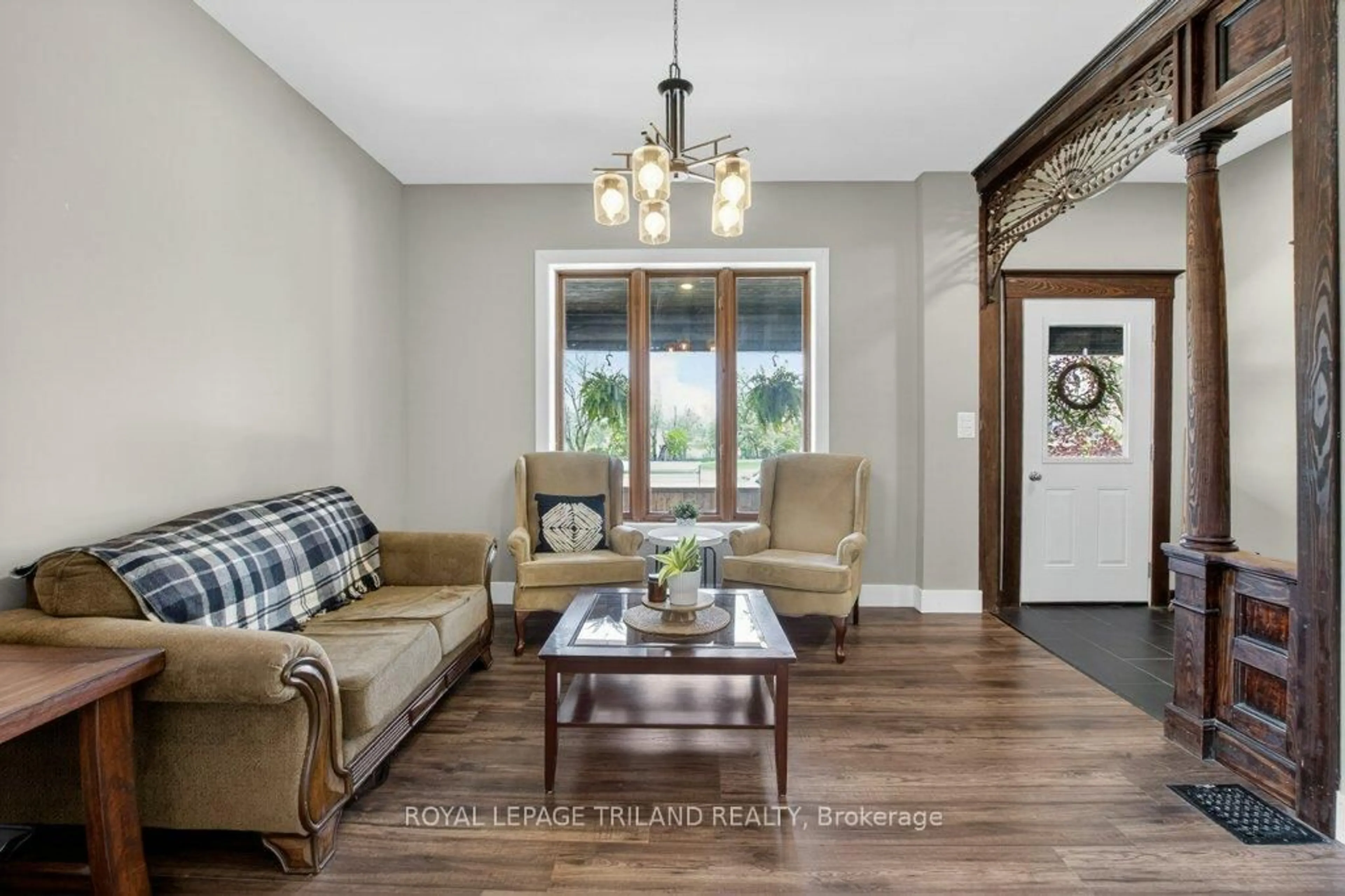 Living room with furniture, wood/laminate floor for 73.5 Hughes St, St. Thomas Ontario N5P 2Y7