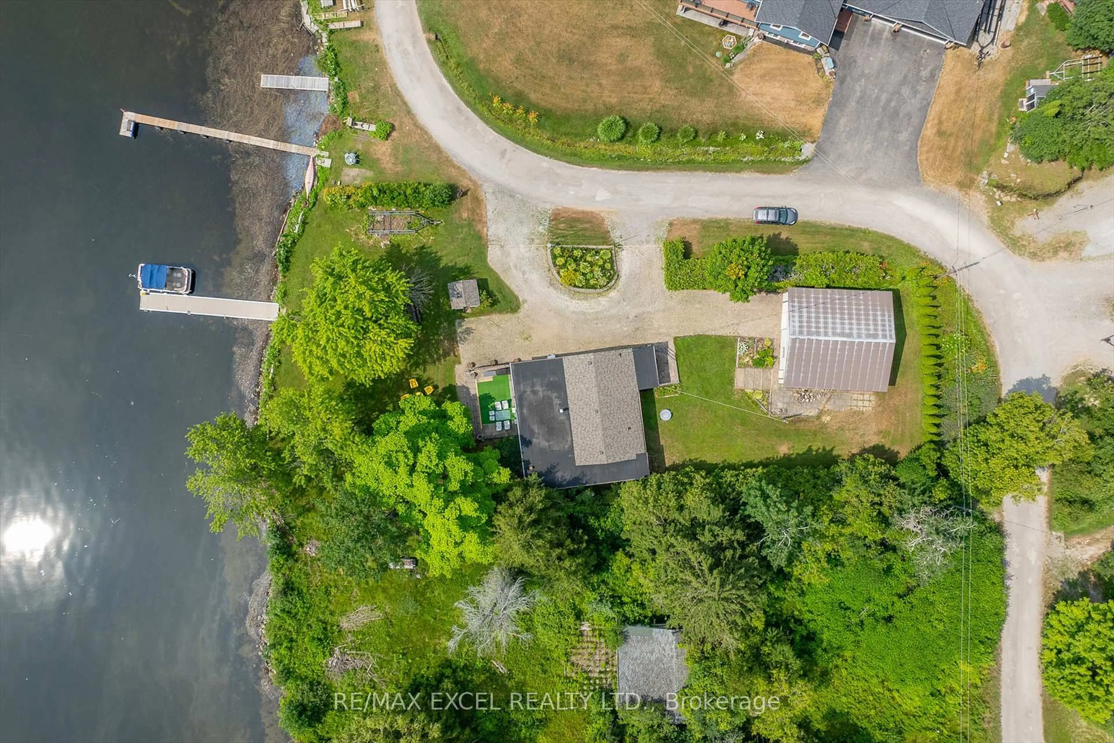 A pic from outside/outdoor area/front of a property/back of a property/a pic from drone, water/lake/river/ocean view for 665 North Shore Dr, Otonabee-South Monaghan Ontario P7B 6B3