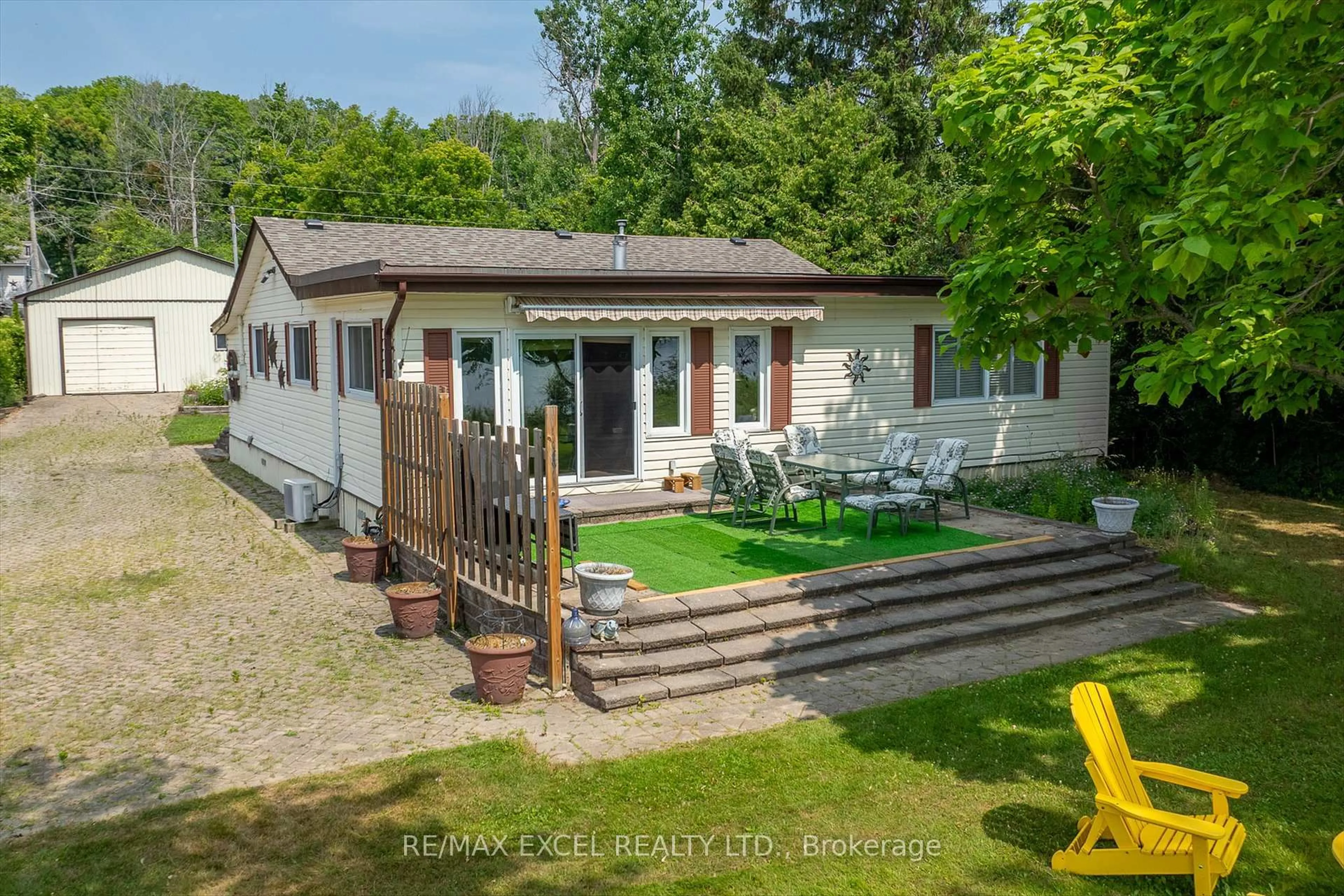 A pic from outside/outdoor area/front of a property/back of a property/a pic from drone, street for 665 North Shore Dr, Otonabee-South Monaghan Ontario P7B 6B3