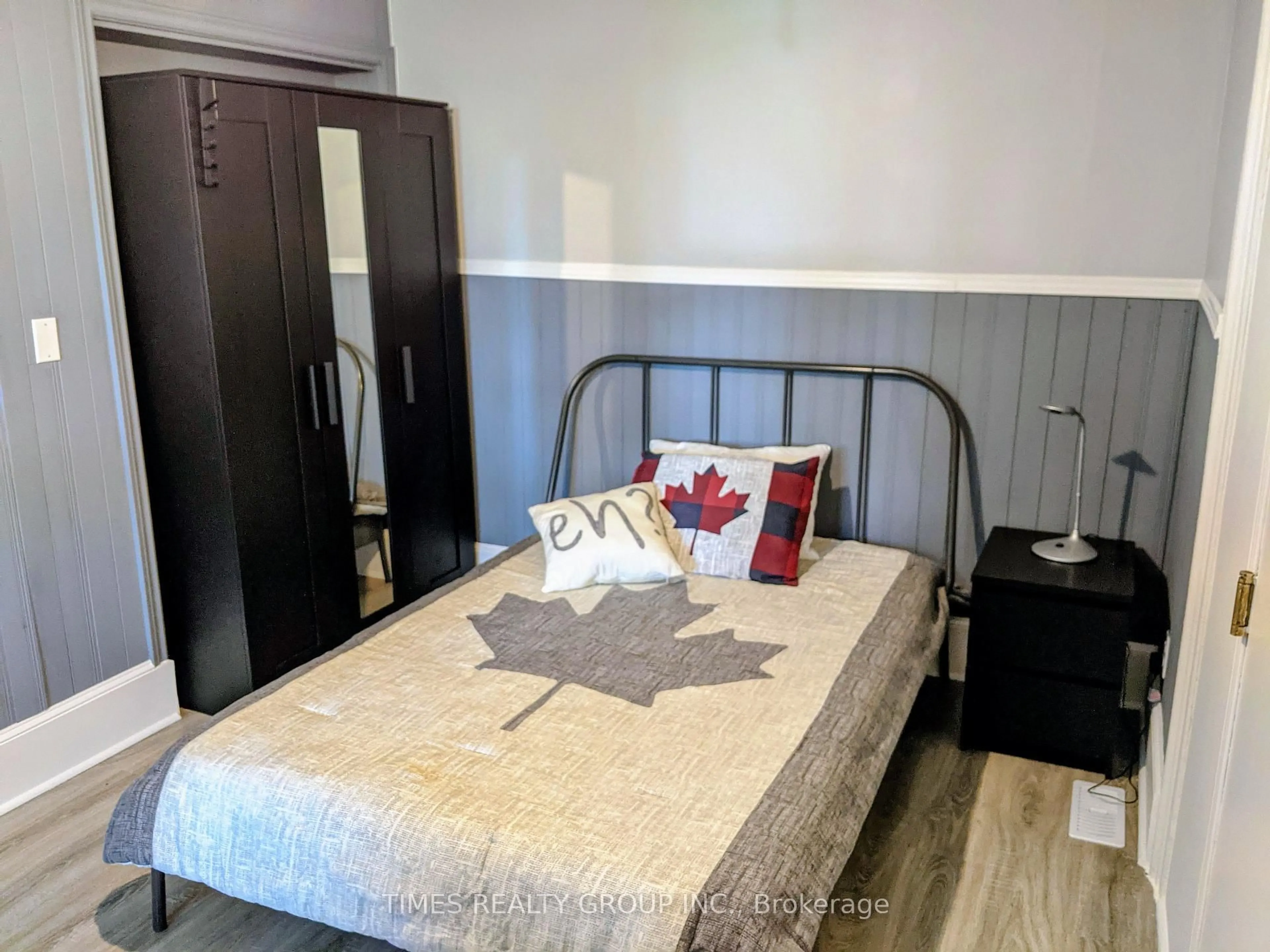 Bedroom with bed, wood/laminate floor for 10 - 12 Murney St, Belleville Ontario K8P 3N6