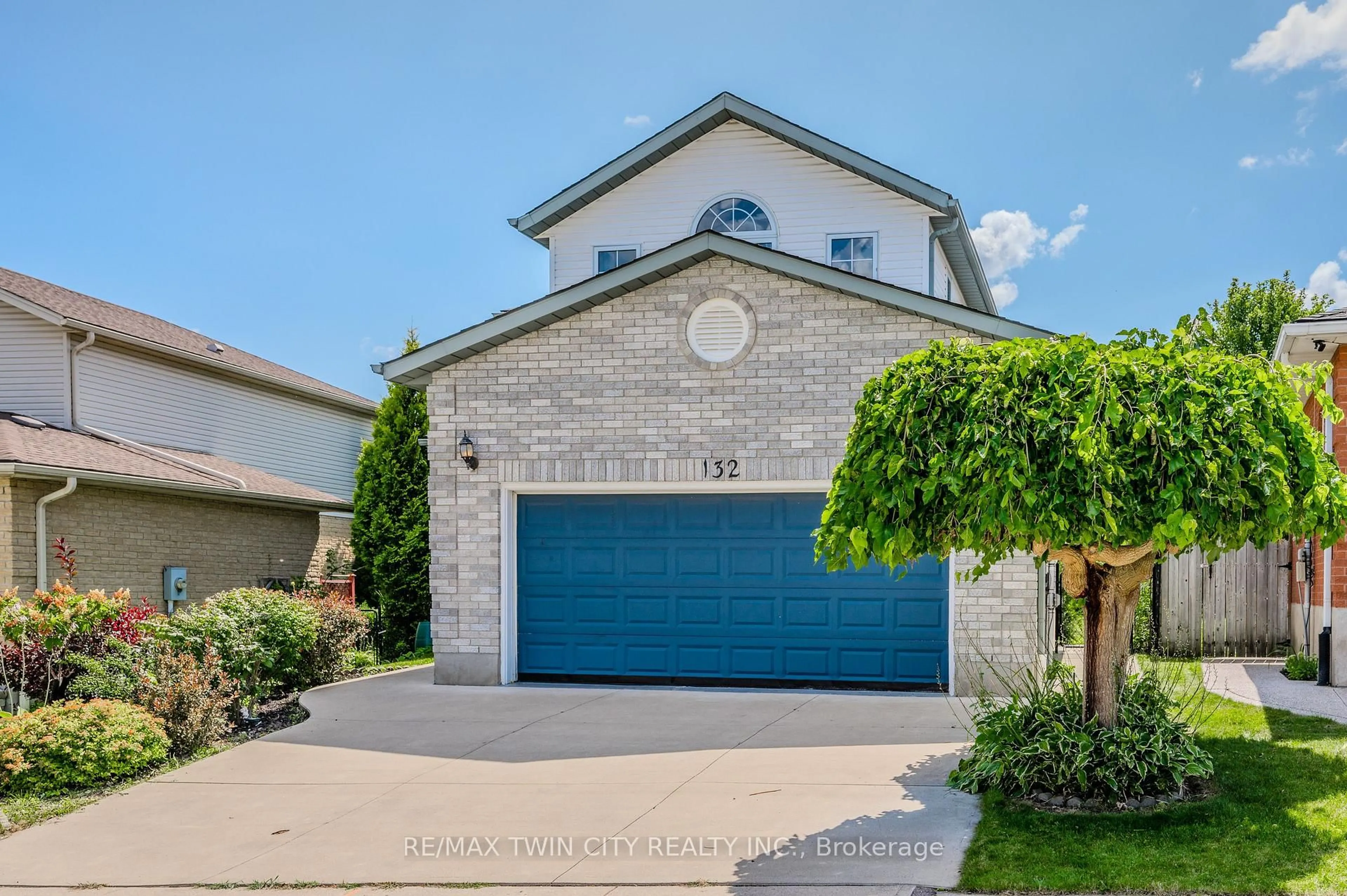 Home with brick exterior material, street for 132 Daimler Dr, Kitchener Ontario N2A 4C2