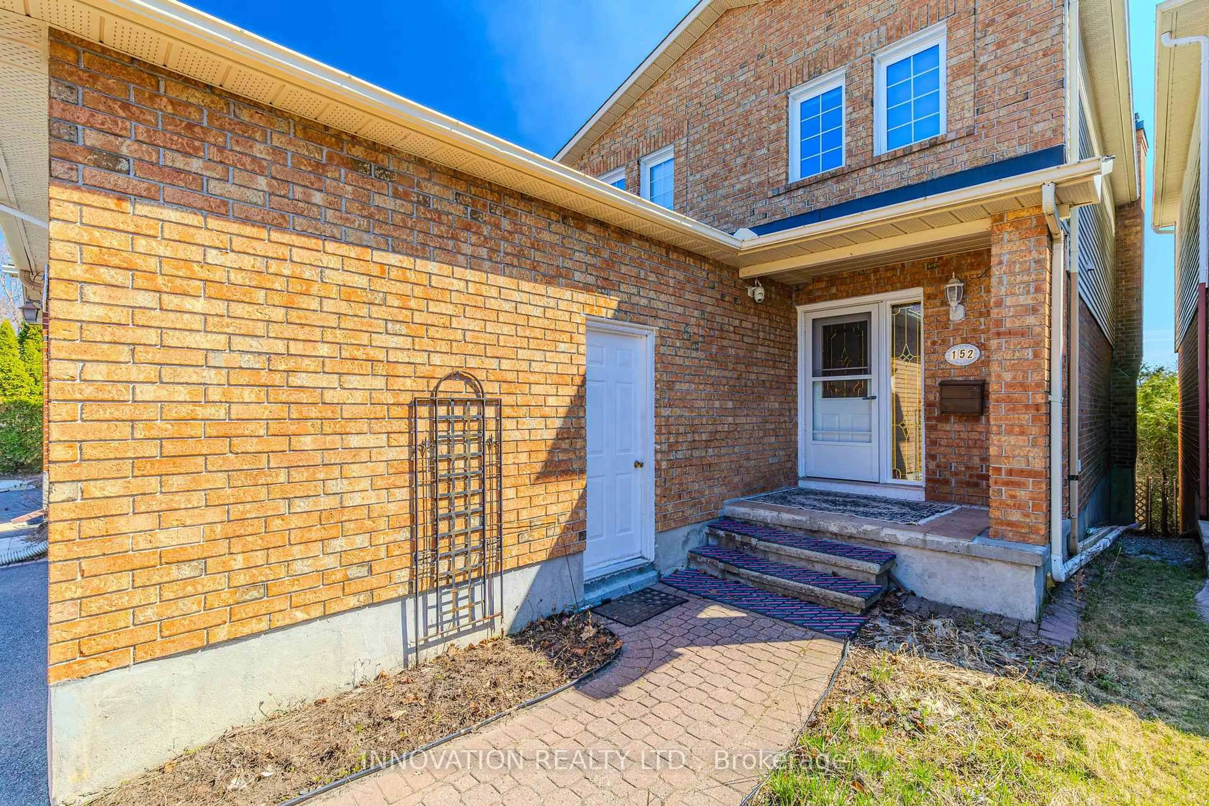 Home with brick exterior material, street for 152 McCurdy Dr, Ottawa Ontario K2L 2Z6