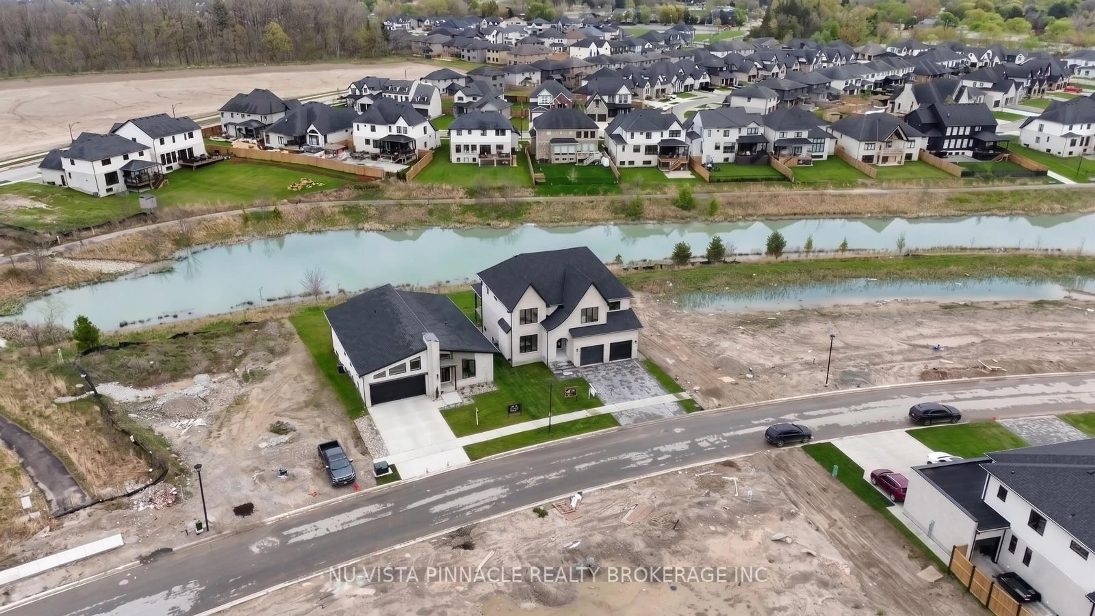 A pic from outside/outdoor area/front of a property/back of a property/a pic from drone, water/lake/river/ocean view for 4108 Fallingbrook Rd, London South Ontario N6P 1H5