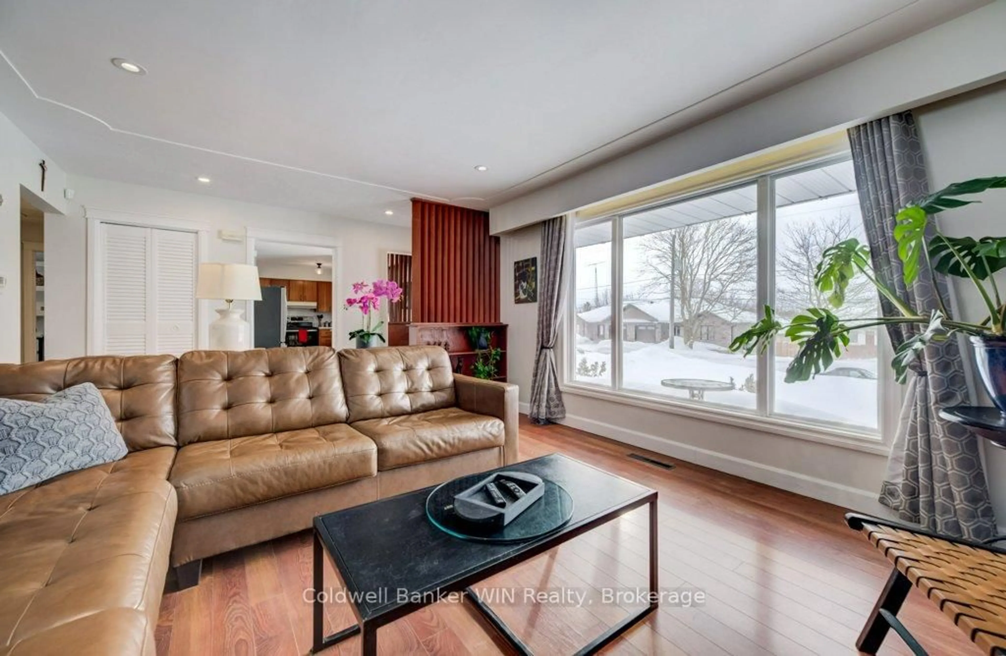 Living room with furniture, wood/laminate floor for 185 Miller St, Wellington North Ontario N0G 2L3