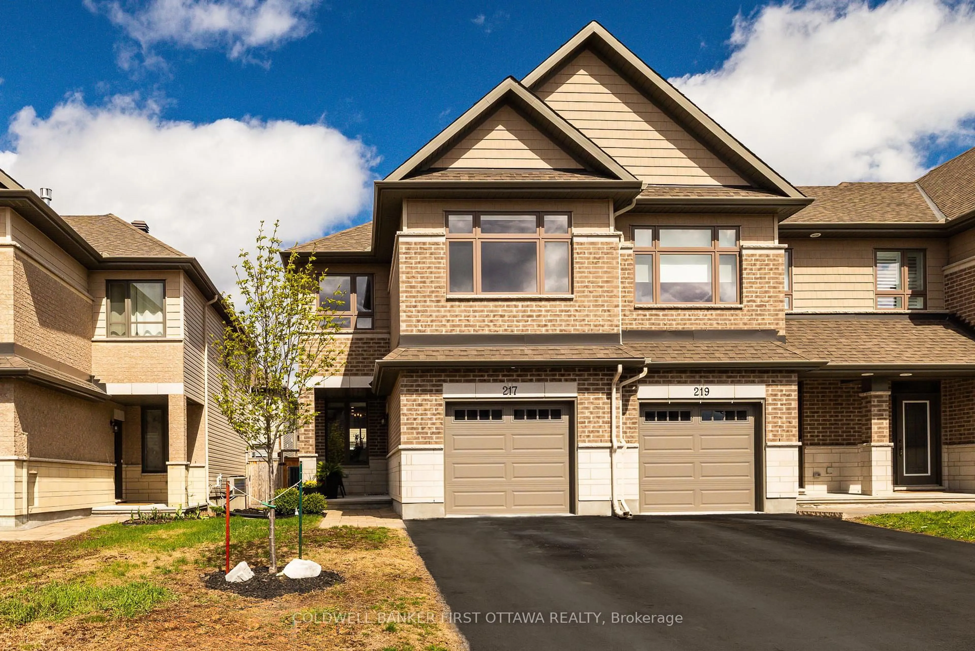 Home with brick exterior material, street for 217 PURCHASE Cres, Stittsville Ontario K2S 2L8
