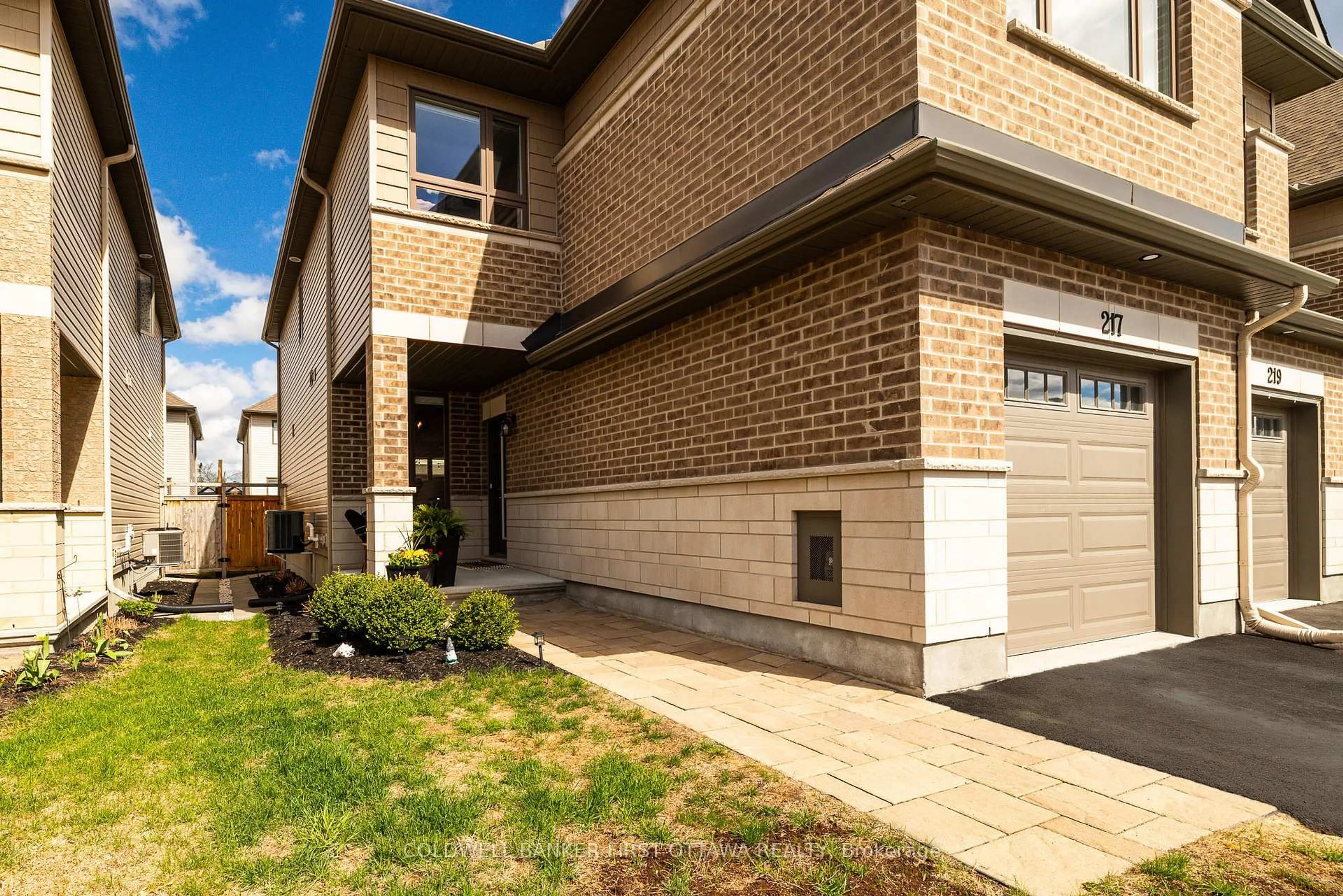 Home with brick exterior material, street for 217 PURCHASE Cres, Stittsville Ontario K2S 2L8