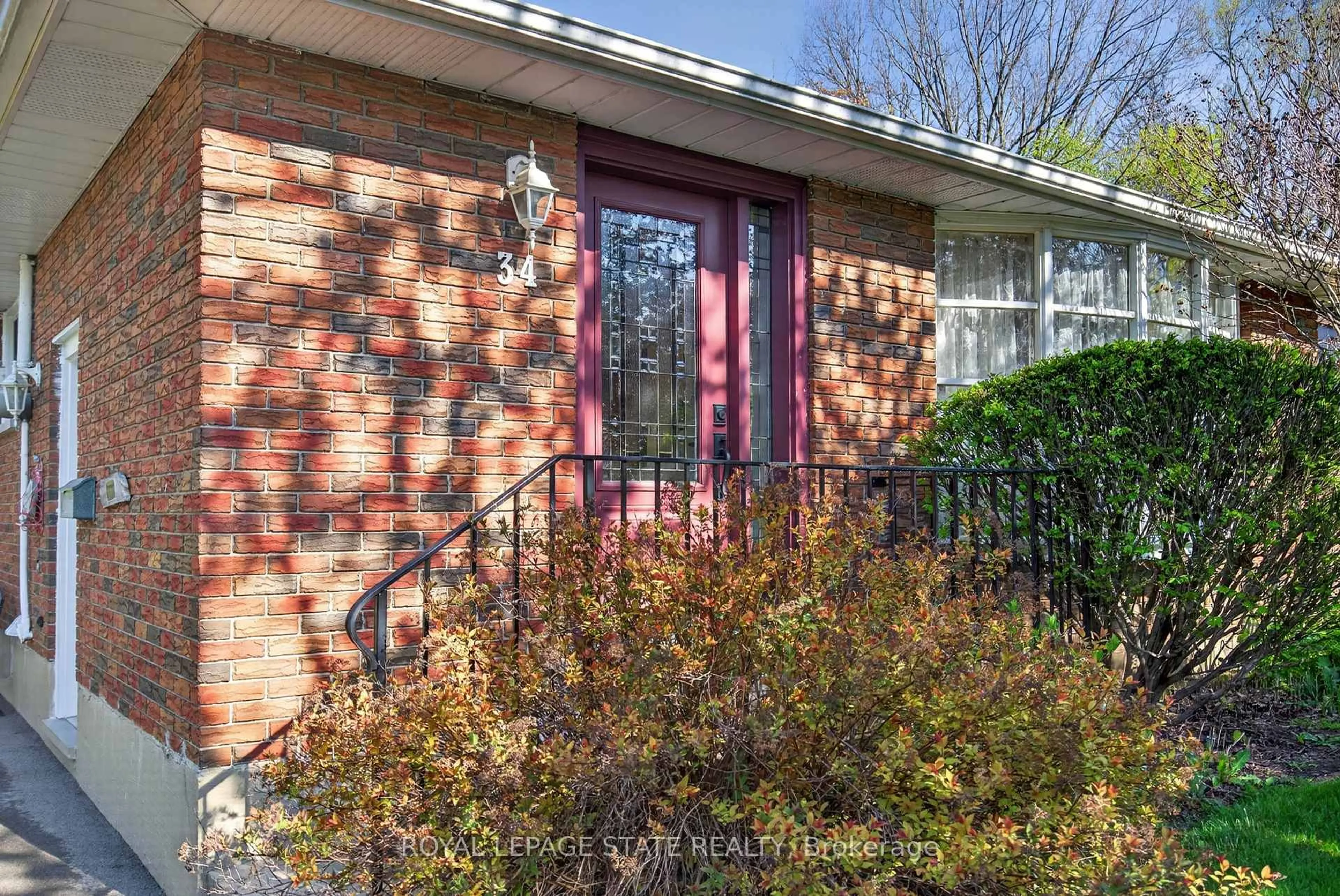 Home with brick exterior material, street for 34 Helen St, Hamilton Ontario L9H 1N3