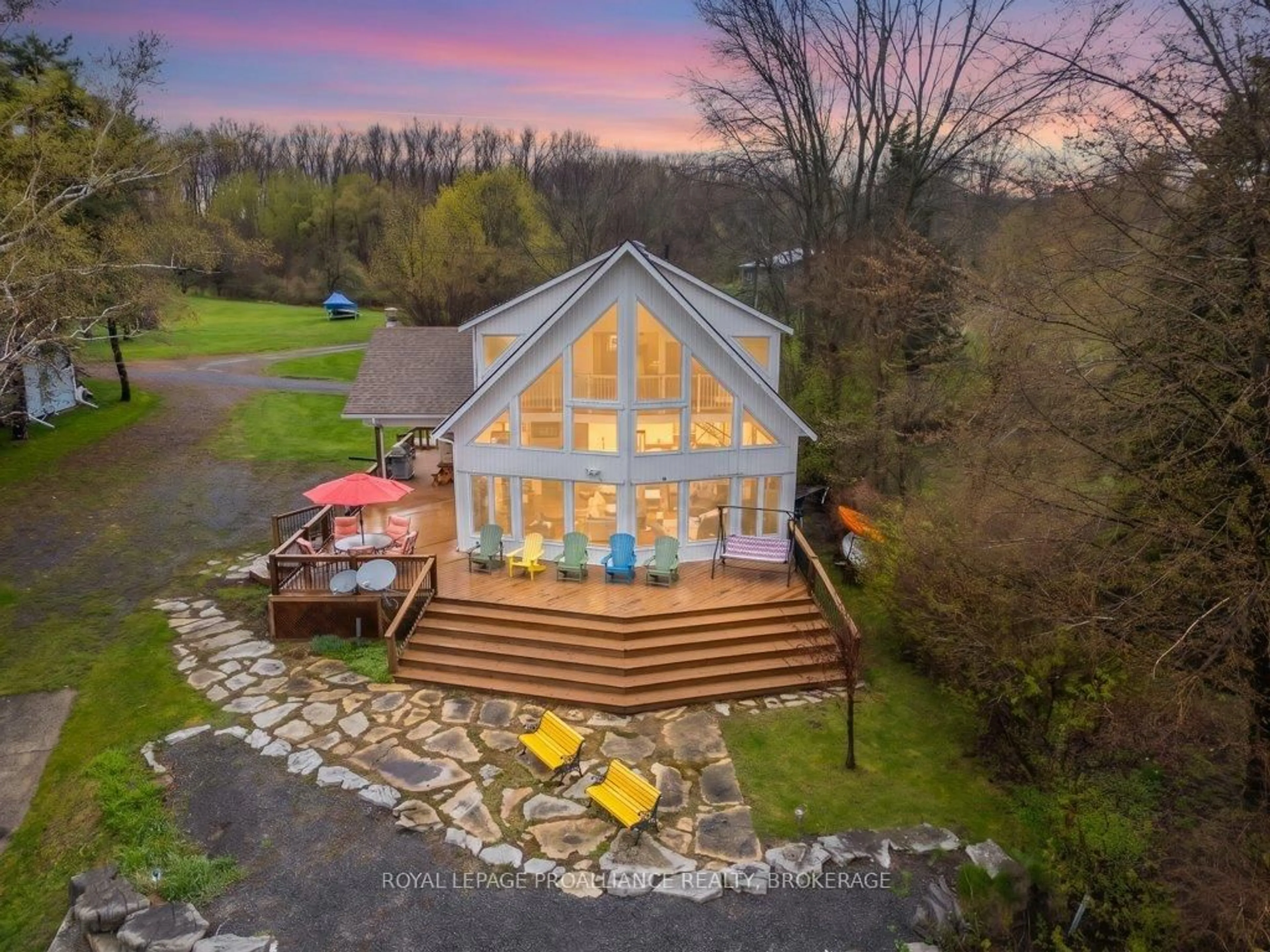A pic from outside/outdoor area/front of a property/back of a property/a pic from drone, unknown for 243 Leone's Cove Lane, Wolfe Island Ontario K0H 2Y0