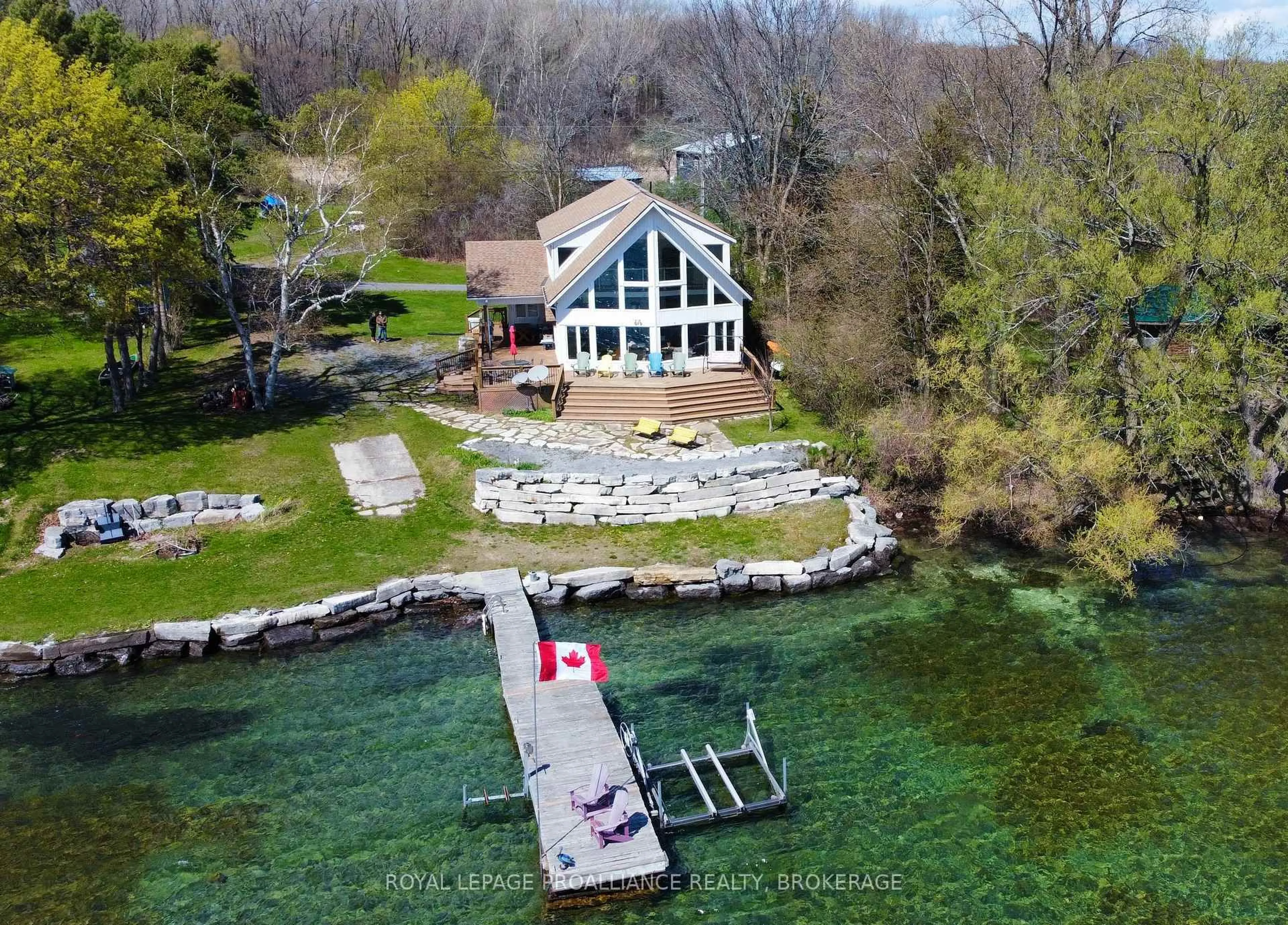 A pic from outside/outdoor area/front of a property/back of a property/a pic from drone, water/lake/river/ocean view for 243 Leone's Cove Lane, Wolfe Island Ontario K0H 2Y0