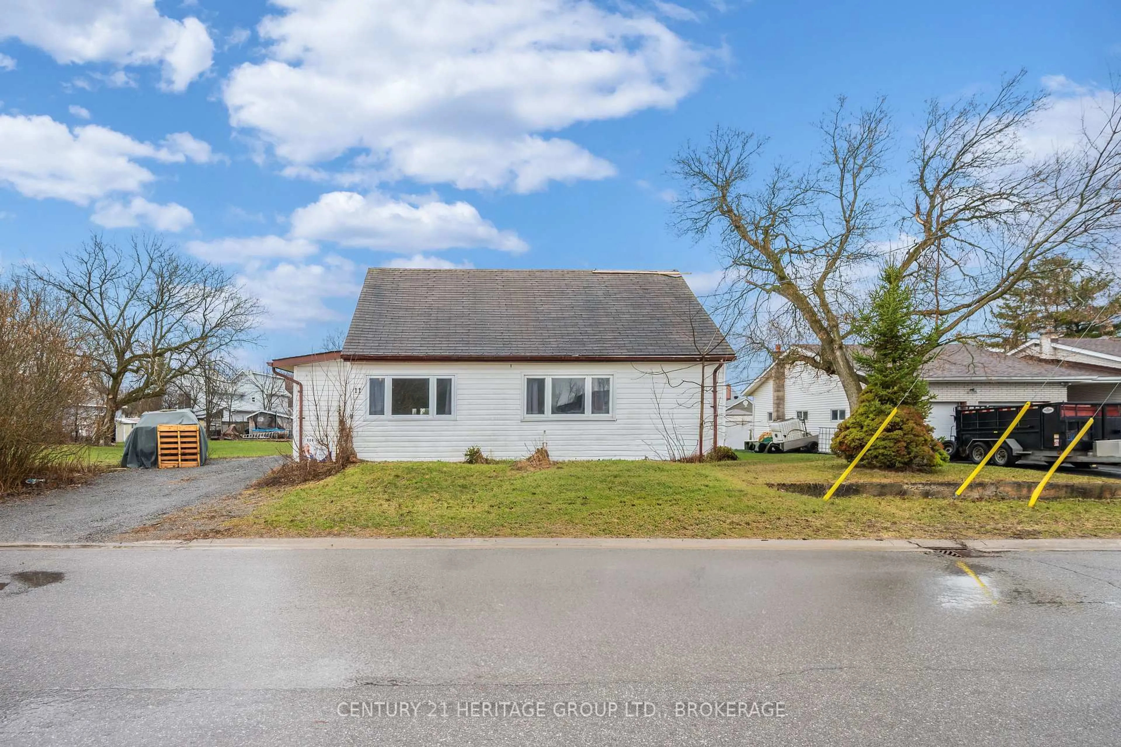 A pic from outside/outdoor area/front of a property/back of a property/a pic from drone, street for 11 North St, Bissett Creek Ontario K0H 2H0