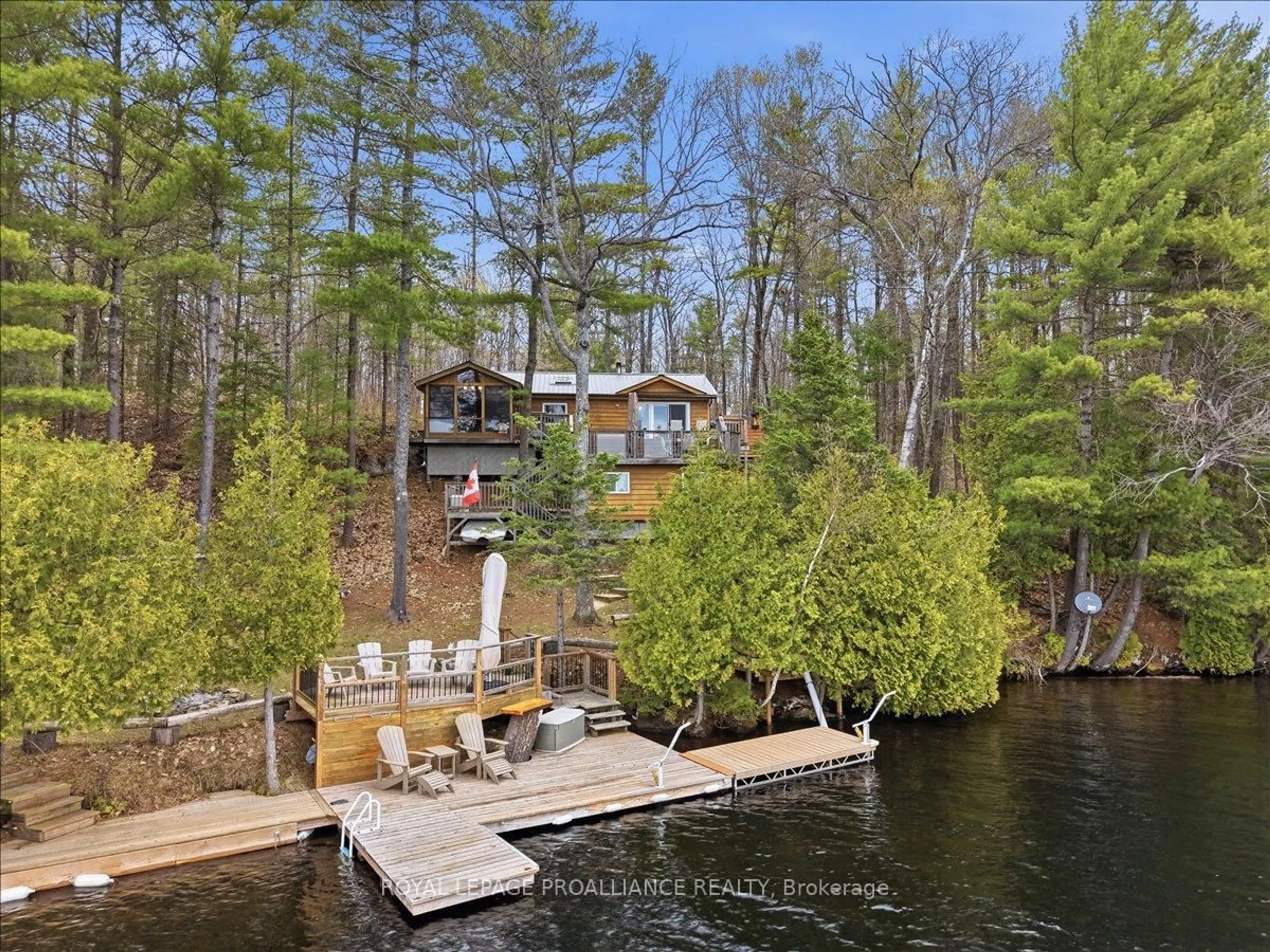A pic from outside/outdoor area/front of a property/back of a property/a pic from drone, water/lake/river/ocean view for 2069 Browns Bay Lane, Cloyne Ontario K0H 1K0
