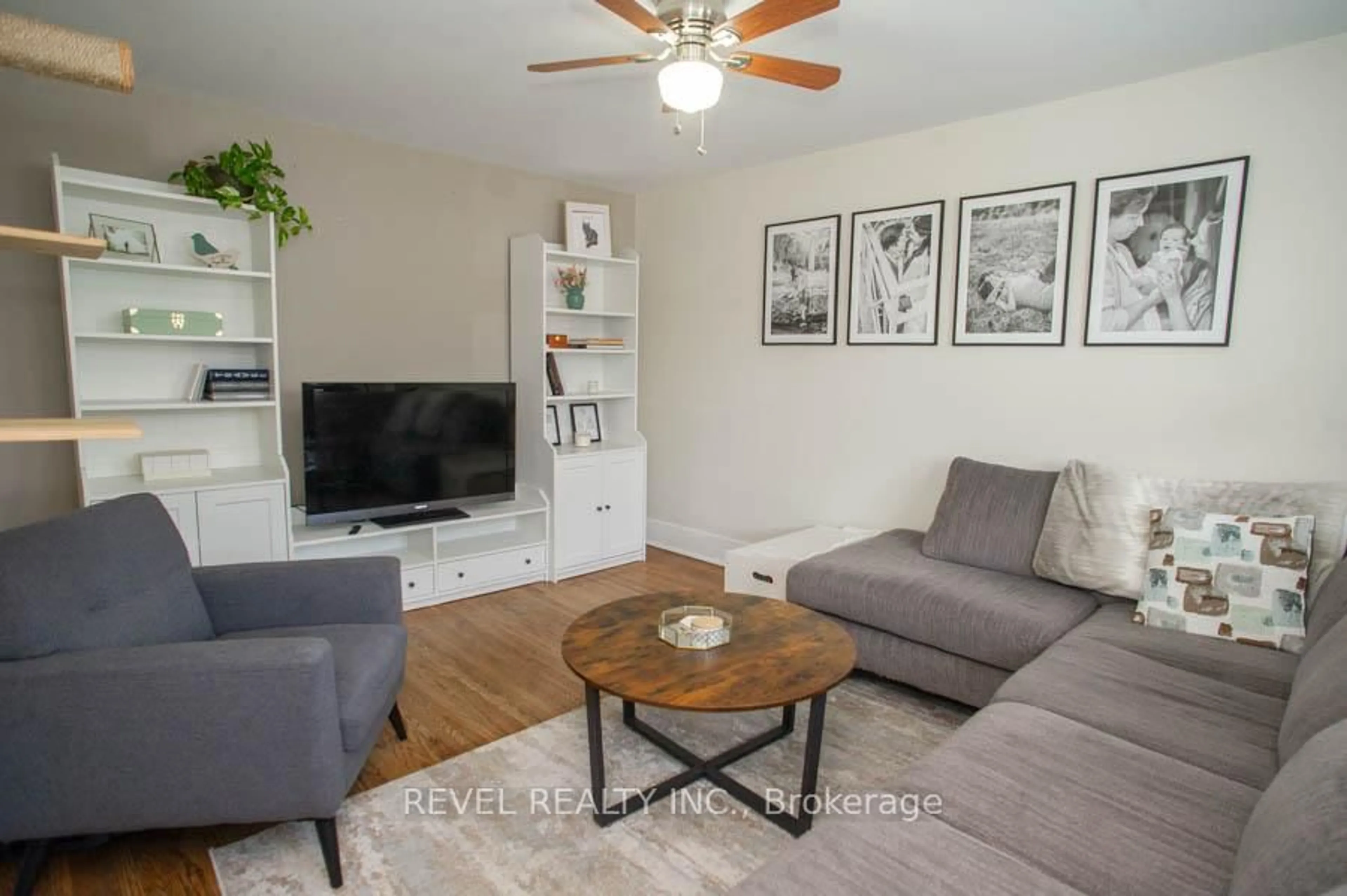 Living room with furniture, wood/laminate floor for 131 Superior St, Brantford Ontario N3S 2L1