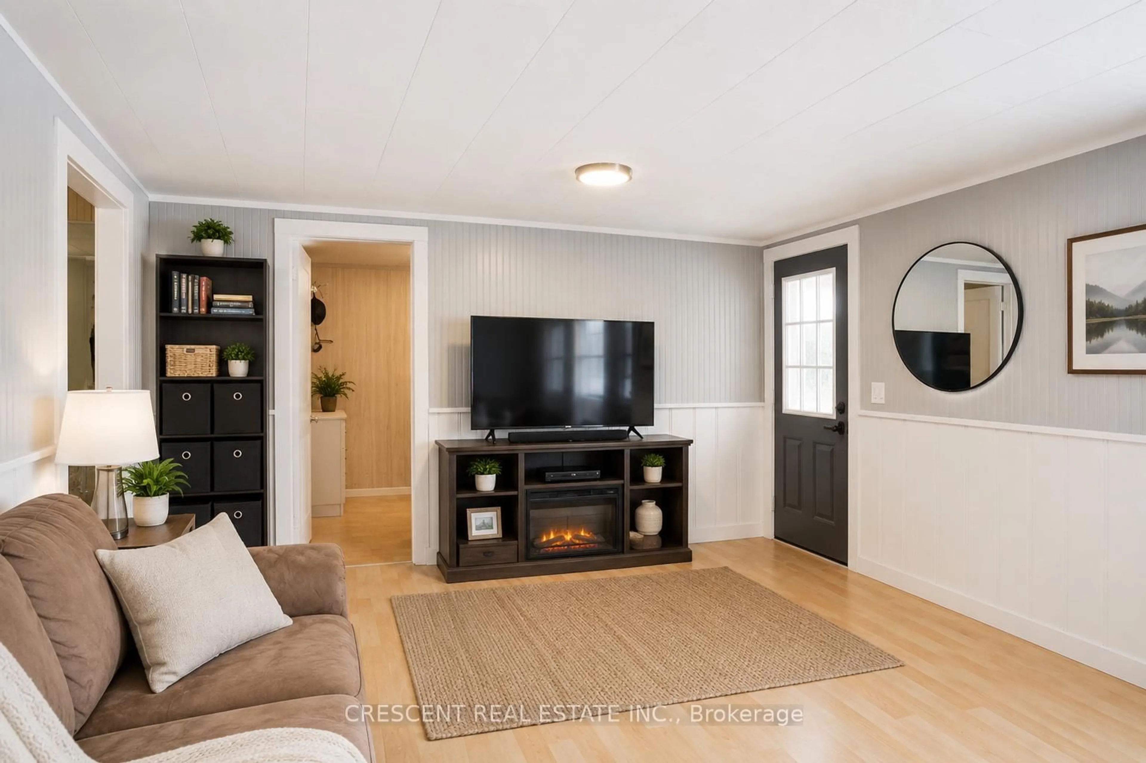 Living room with furniture, wood/laminate floor for 241 Avery Point Rd, Kawartha Lakes Ontario L0K 1W0