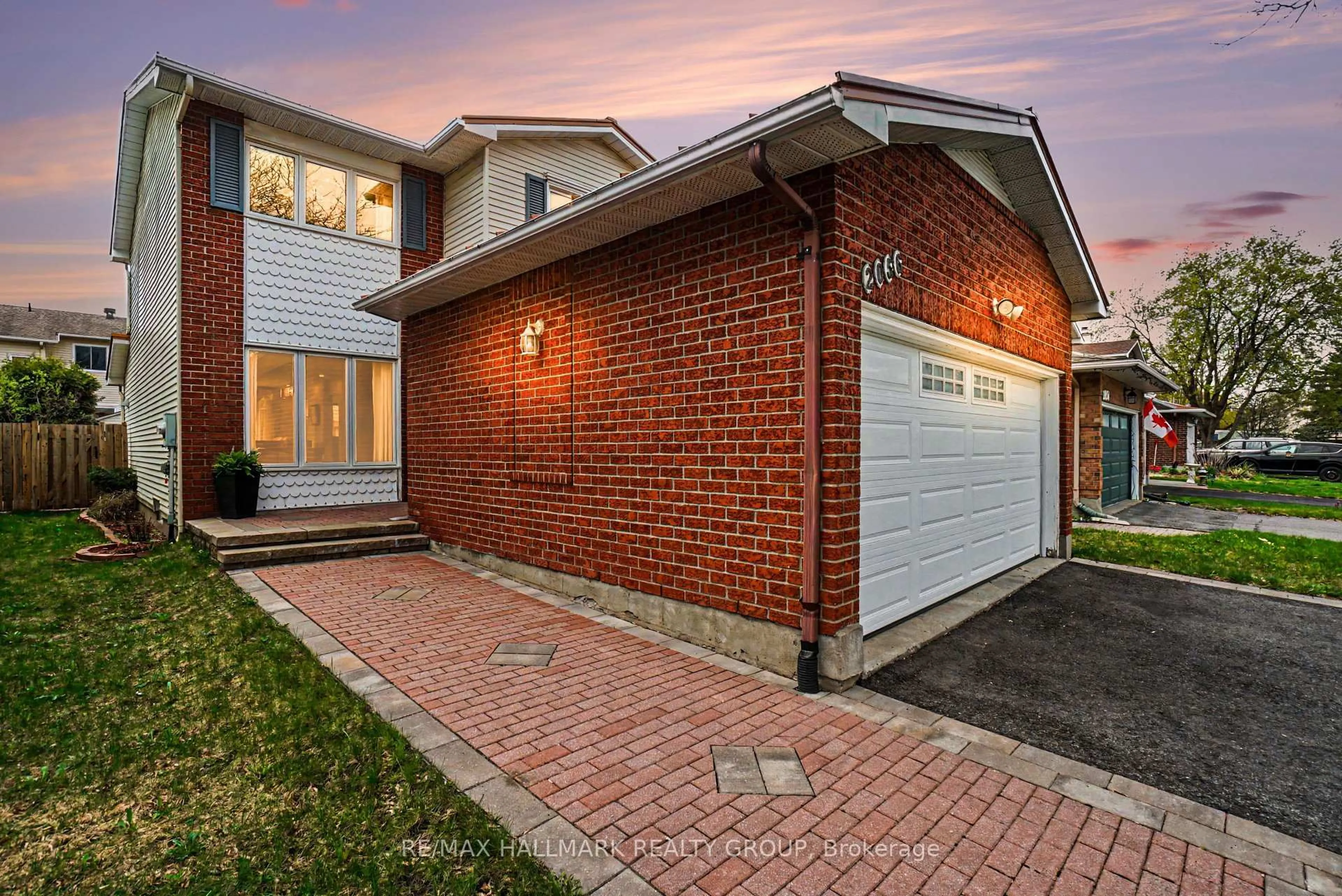 Home with brick exterior material, street for 2056 Wildflower Dr, Orleans Ontario K1E 3R3