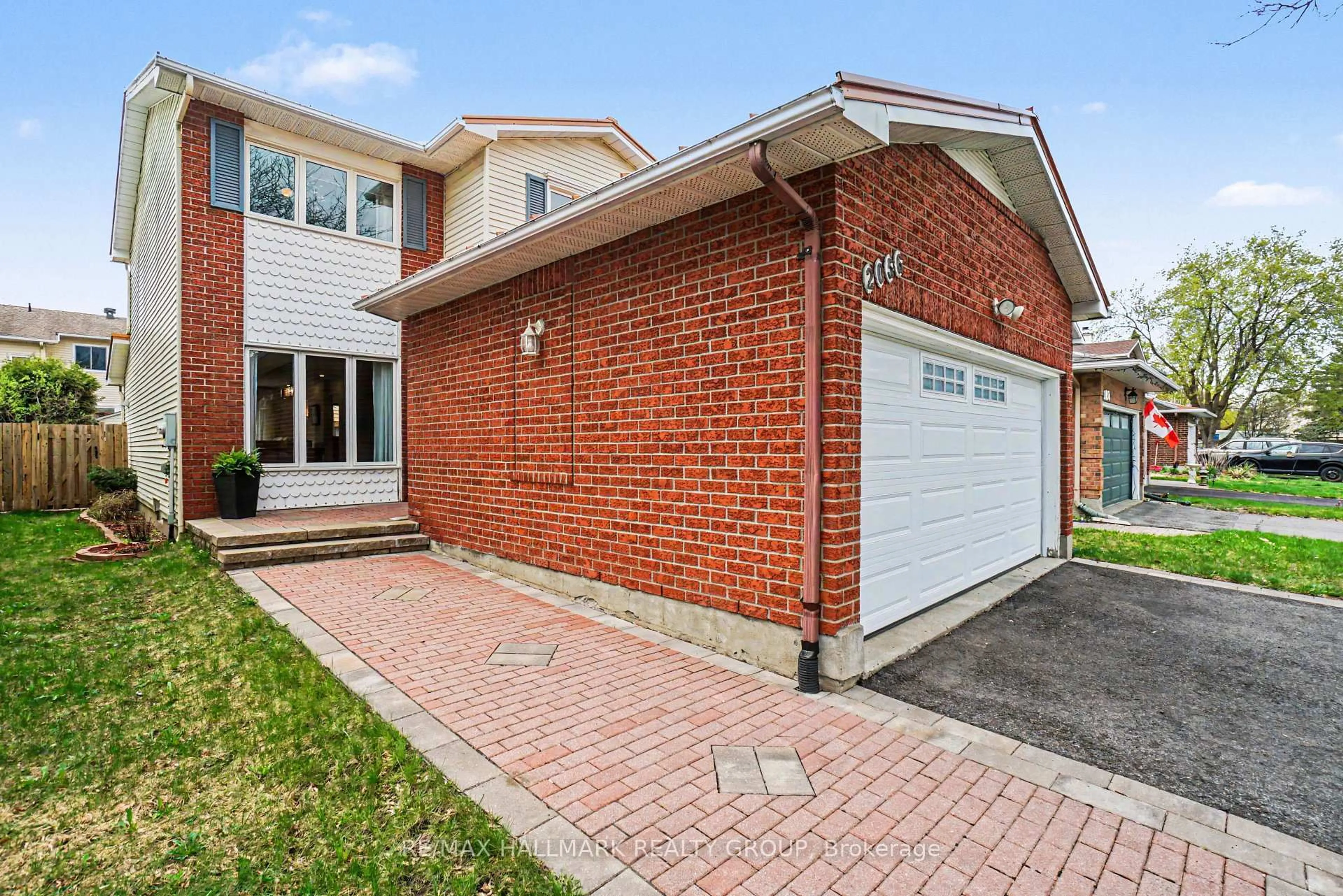 Home with brick exterior material, street for 2056 Wildflower Dr, Orleans Ontario K1E 3R3