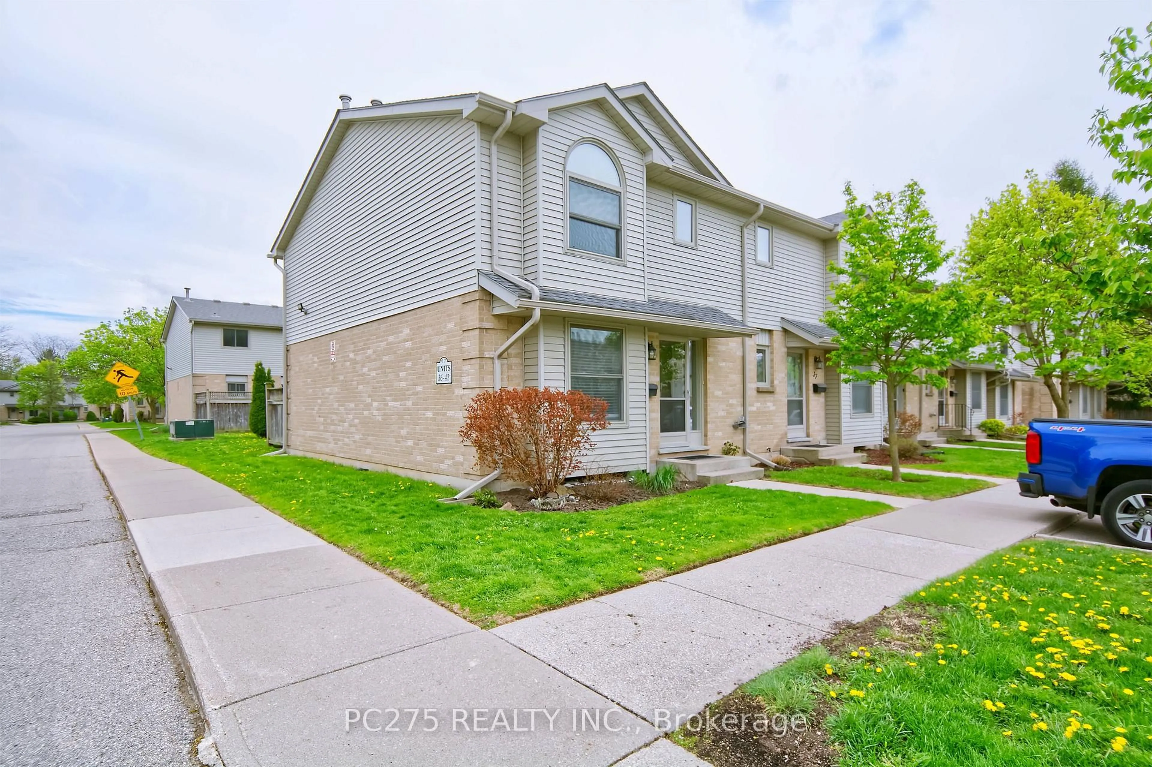 A pic from outside/outdoor area/front of a property/back of a property/a pic from drone, street for 141 Condor Crt #36, London East Ontario N5W 6A1