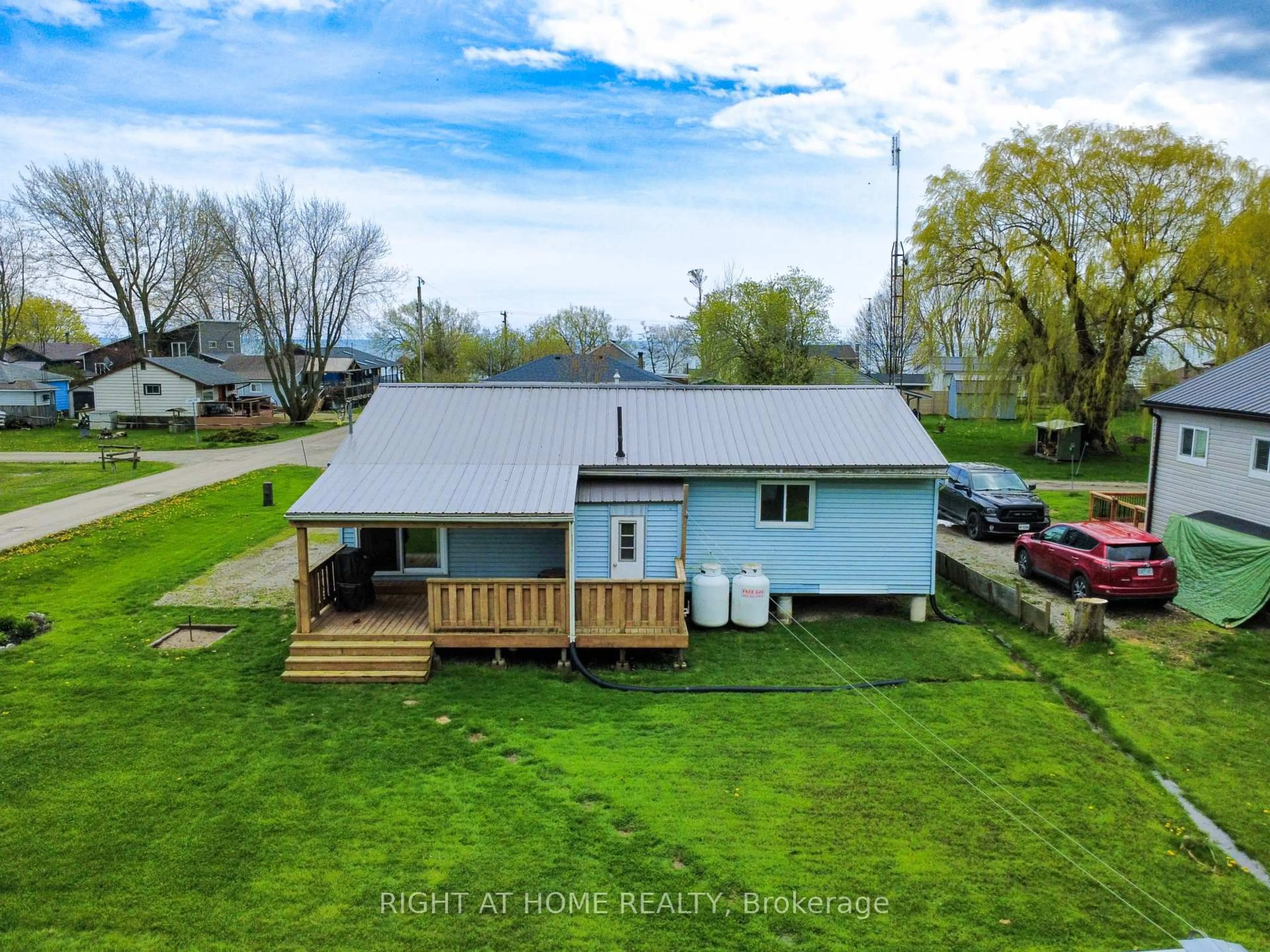 A pic from outside/outdoor area/front of a property/back of a property/a pic from drone, water/lake/river/ocean view for 21 Lakeview Lane, Haldimand Ontario N0A 1P0