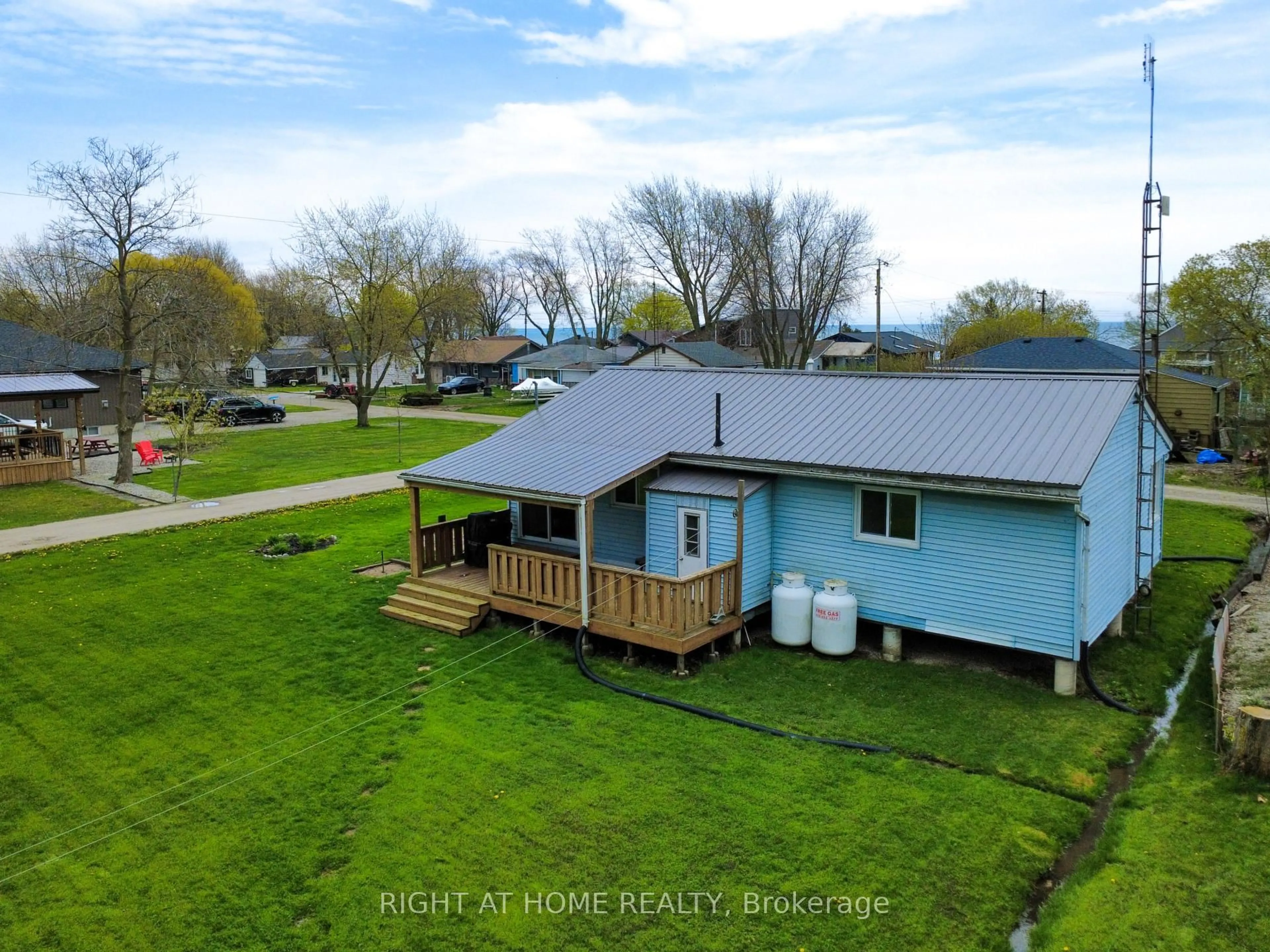 A pic from outside/outdoor area/front of a property/back of a property/a pic from drone, water/lake/river/ocean view for 21 Lakeview Lane, Haldimand Ontario N0A 1P0