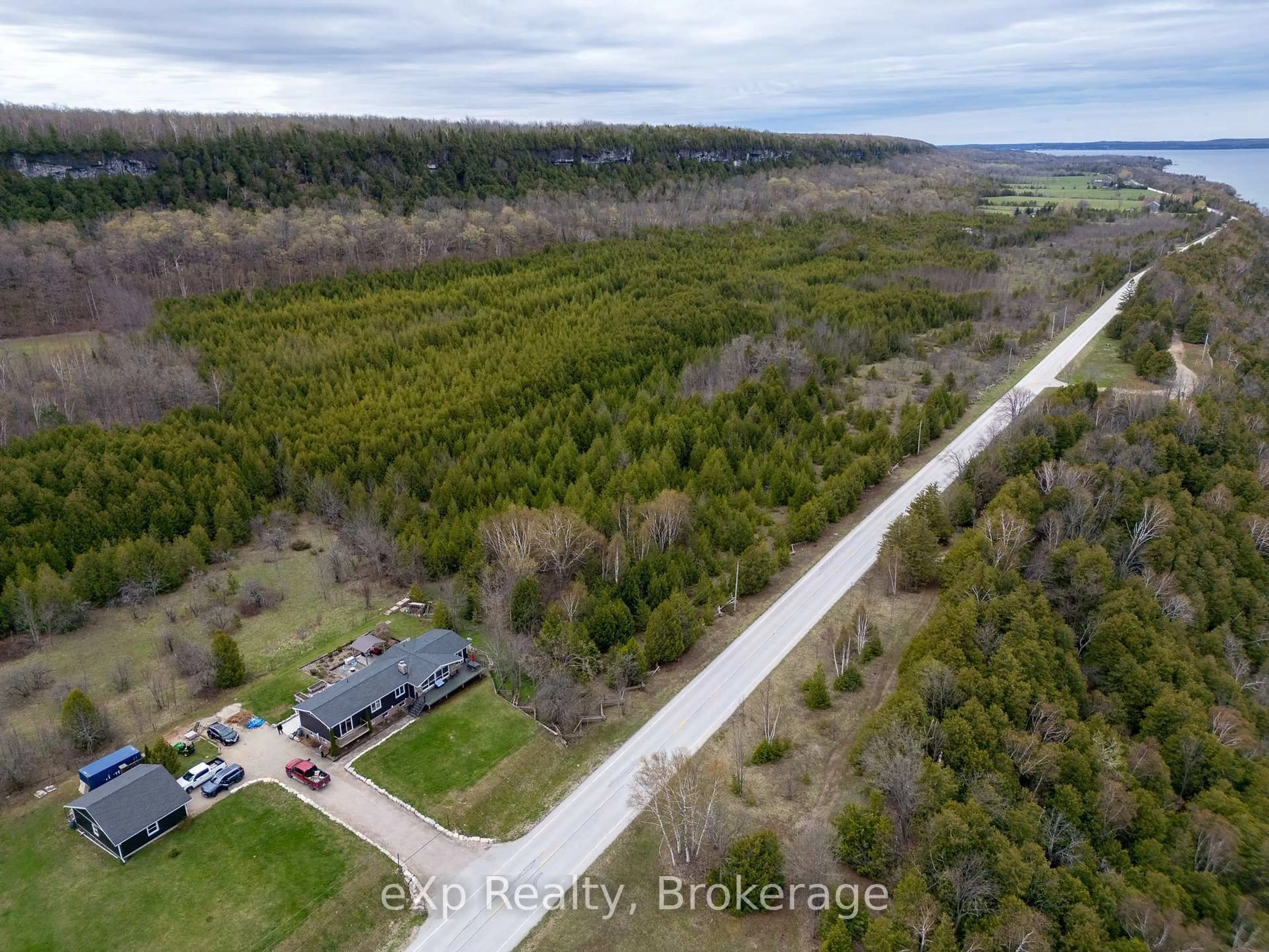 A pic from outside/outdoor area/front of a property/back of a property/a pic from drone, forest/trees view for 502754 Grey Road 1, Georgian Bluffs Ontario N0H 2T0