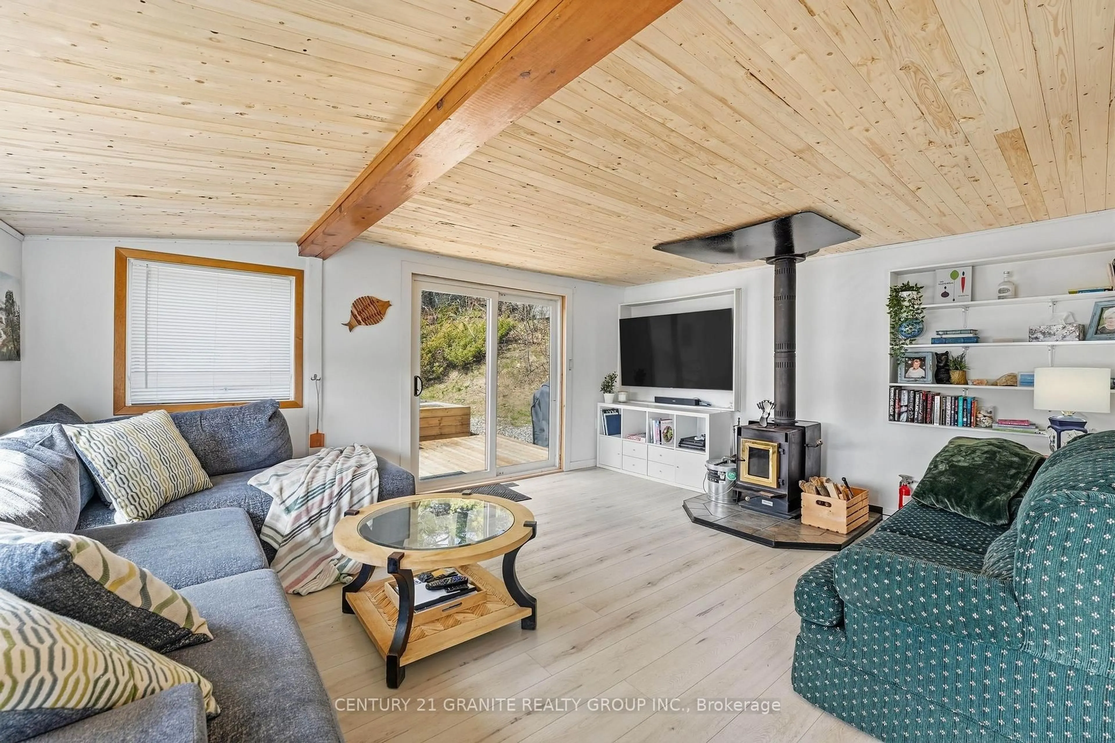 Living room with furniture, wood/laminate floor for 25 Brethour Rd, Bancroft Ontario K0L 1C0
