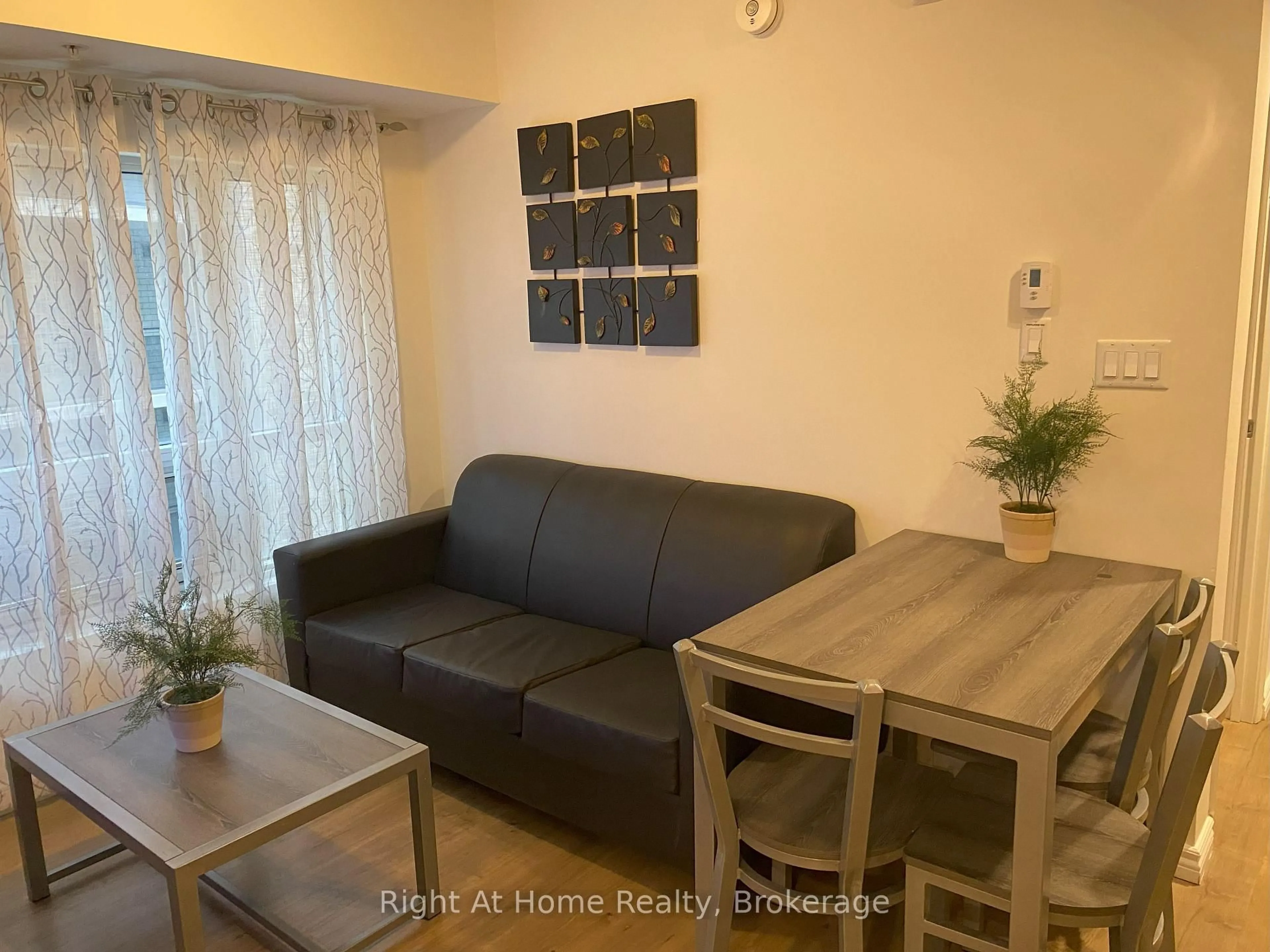 Living room with furniture, wood/laminate floor for 275 LARCH St #G204, Waterloo Ontario N2L 0J4