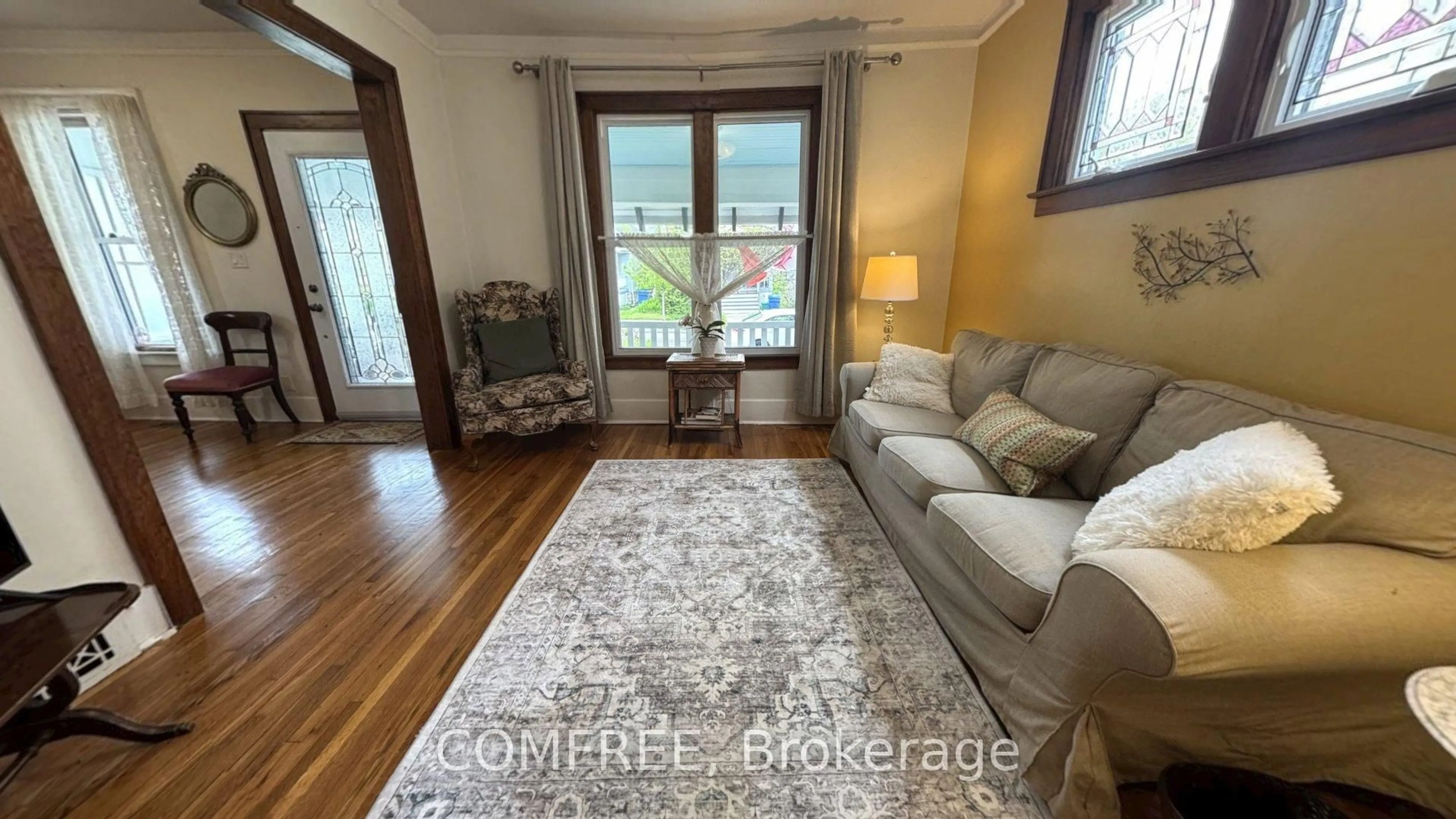 Living room with furniture, wood/laminate floor for 441 McEwan Ave, Out of Area Ontario N9B 2E7