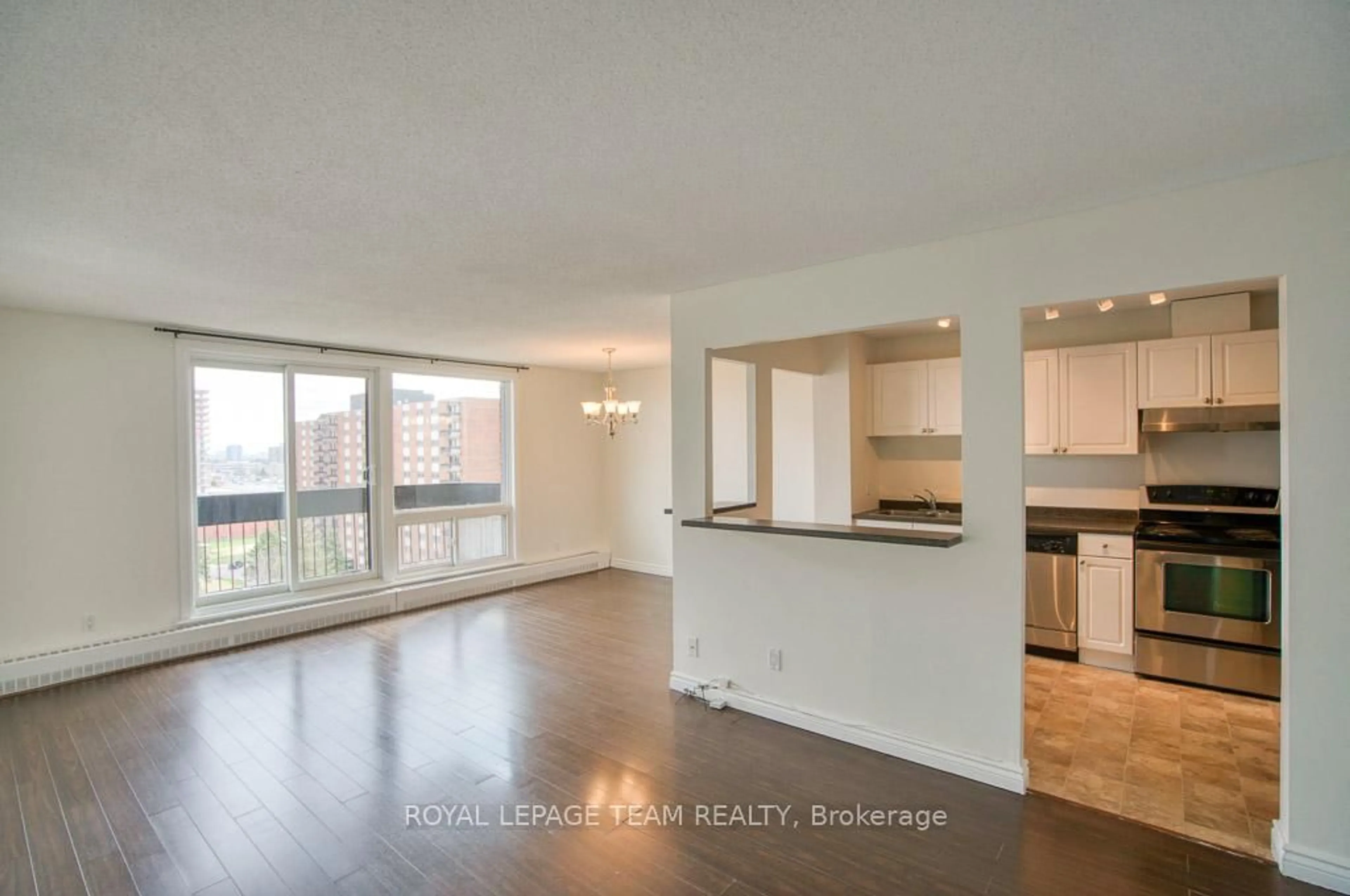 Open concept kitchen, wood/laminate floor for 1505 Baseline Rd #1013, Ottawa Ontario K2C 3L4
