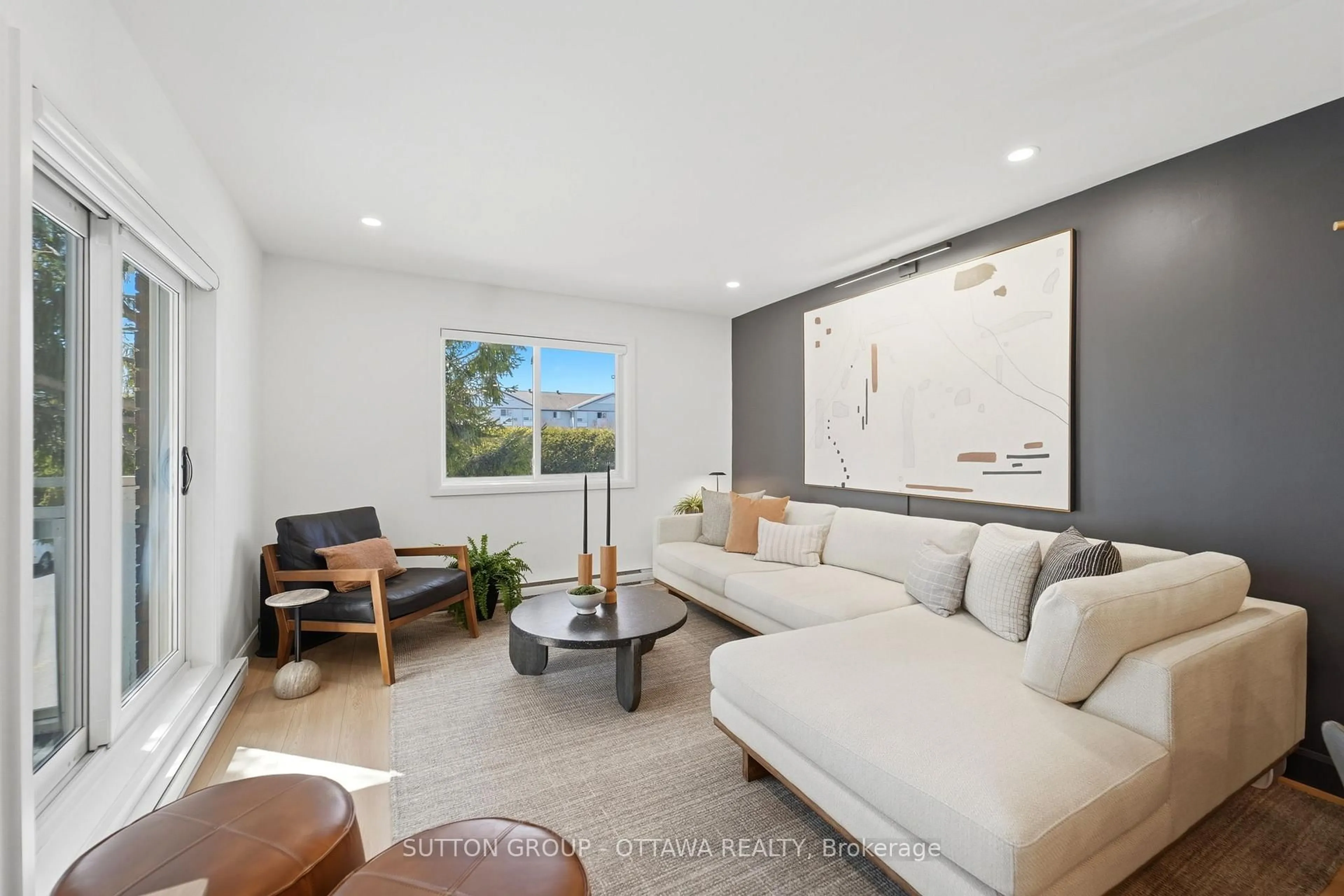Living room with furniture, unknown for 268 Lorry Greenberg Dr #101, Ottawa Ontario K1T 3K1