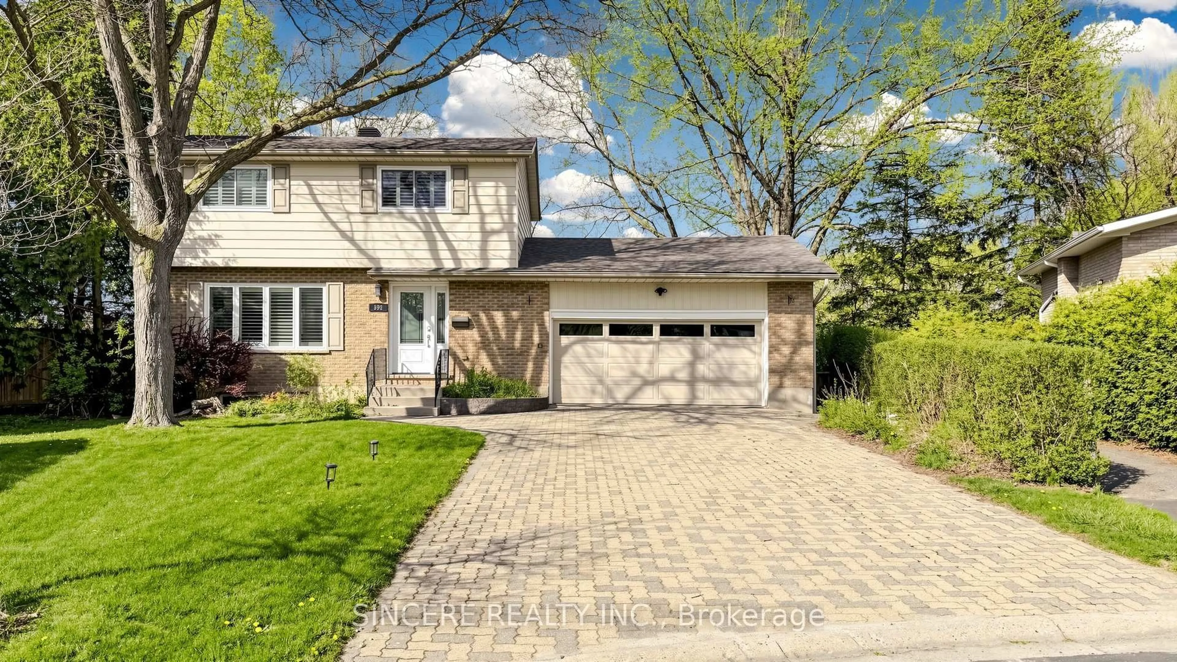 Home with brick exterior material, street for 592 Canewood Cres, Waterloo Ontario N2L 5P5