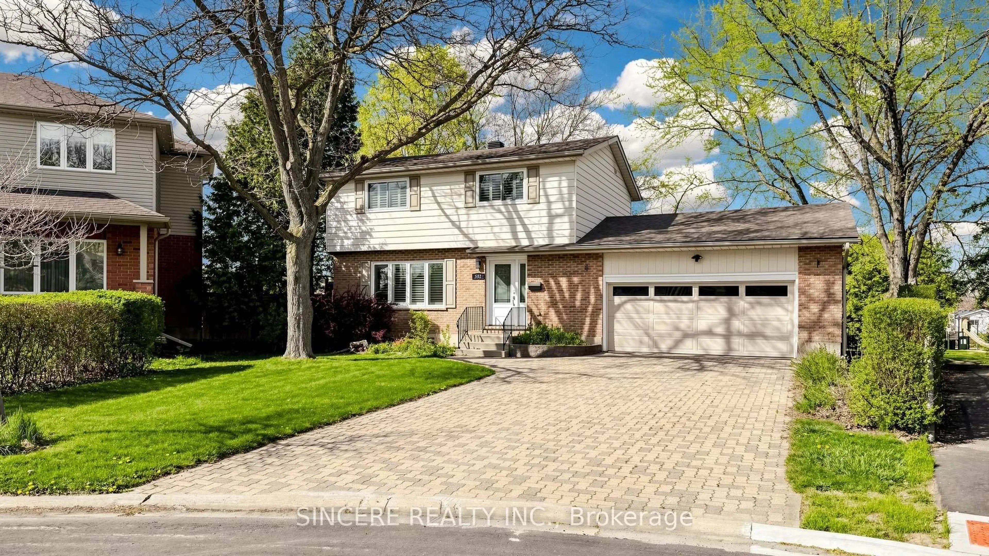 Home with brick exterior material, street for 592 Canewood Cres, Waterloo Ontario N2L 5P5