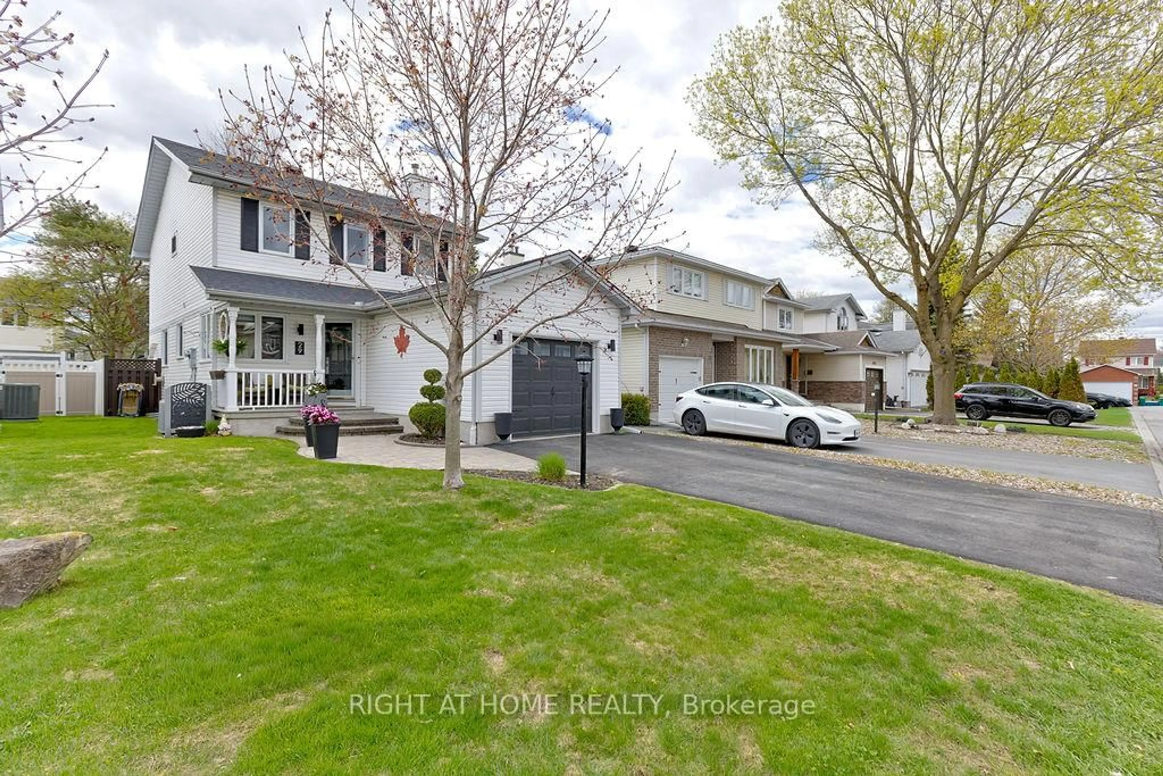 Home with vinyl exterior material, street for 29 Peacock Cres, Ottawa Ontario K2J 3P8