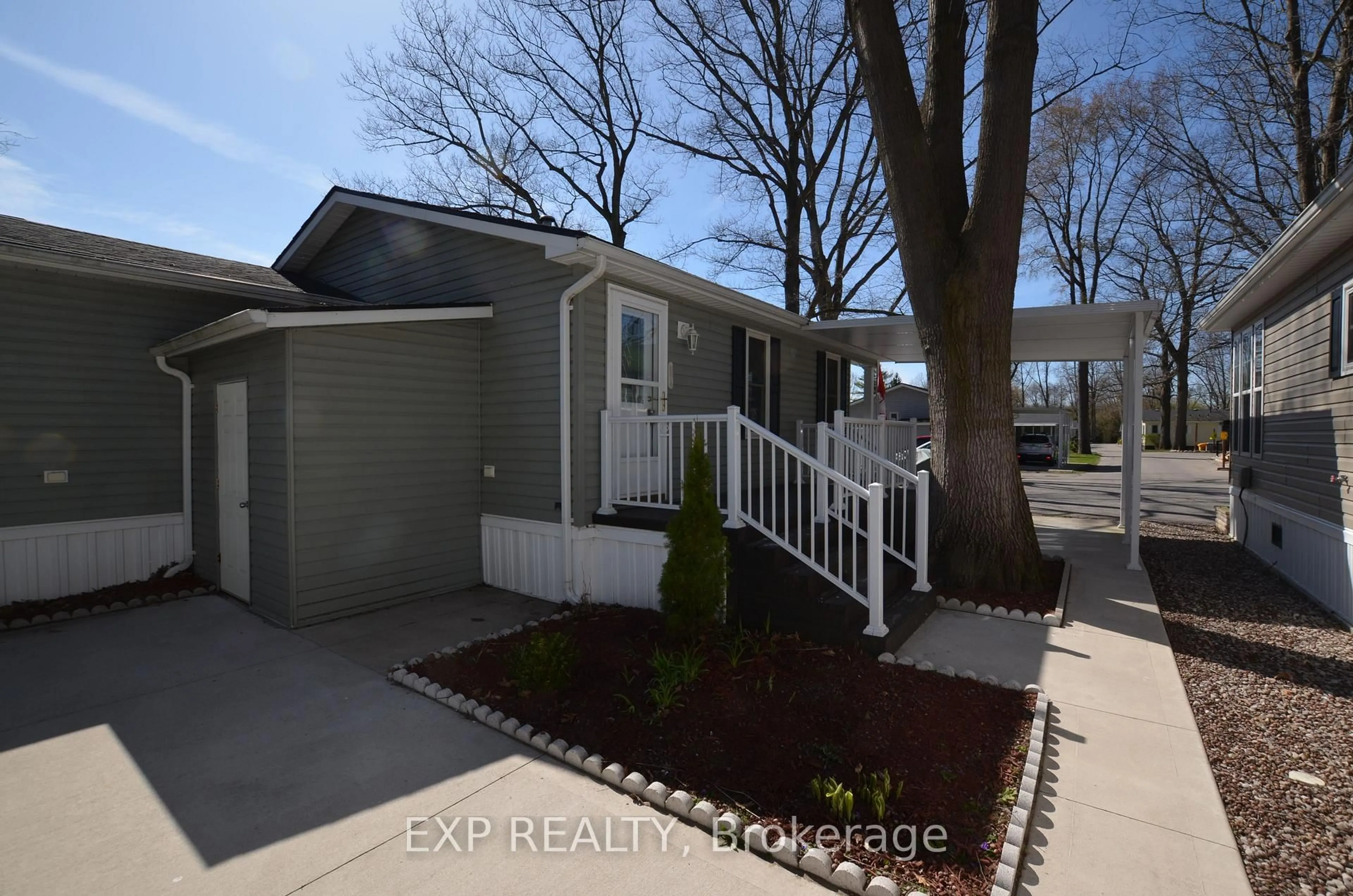 Home with vinyl exterior material, street for 22790 Amiens Rd #51, Middlesex Centre Ontario N0L 1R0