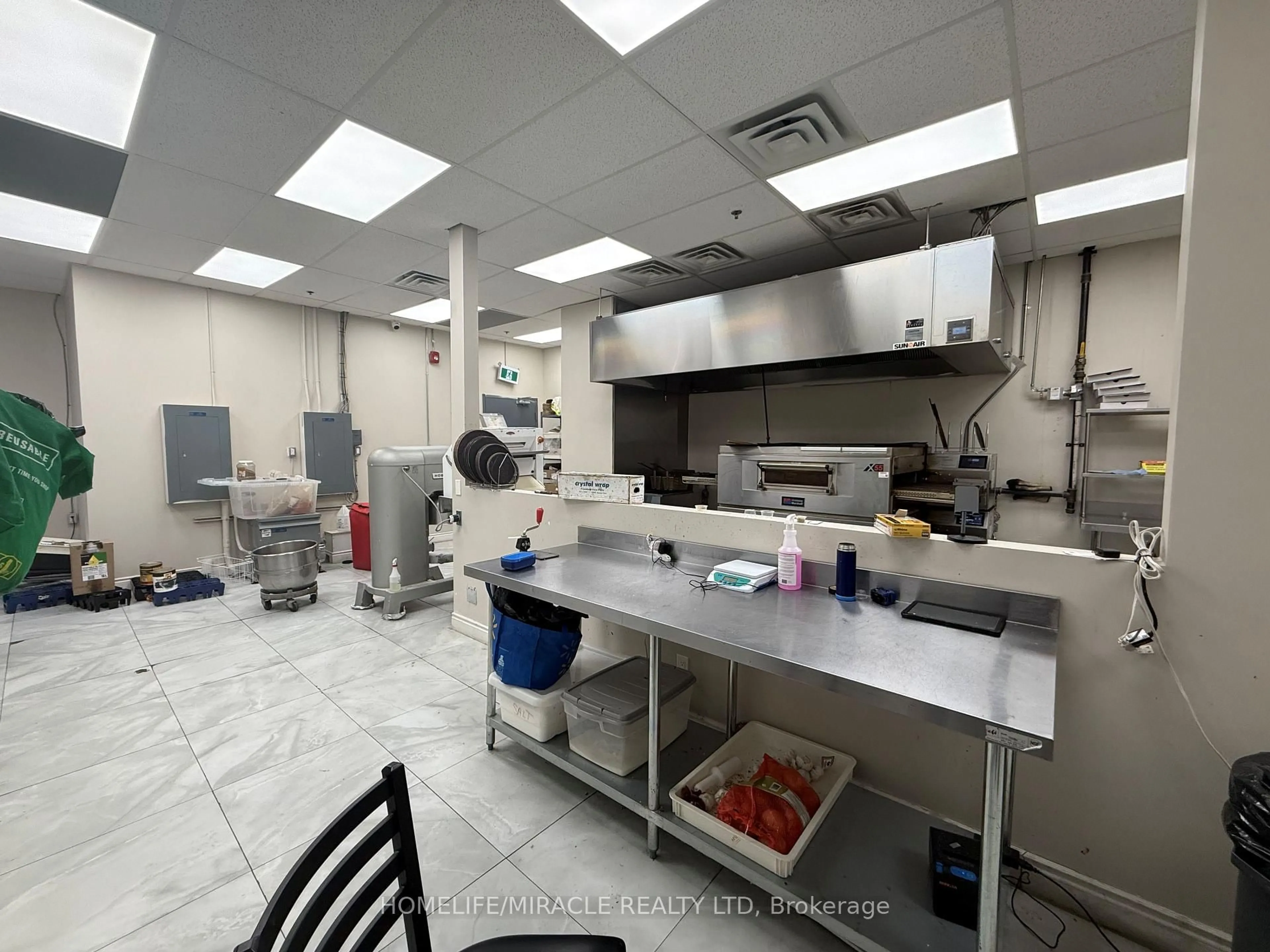 Kitchen with laundary machines, unknown for 60 Frederick St, Kitchener Ontario N2H 0C7
