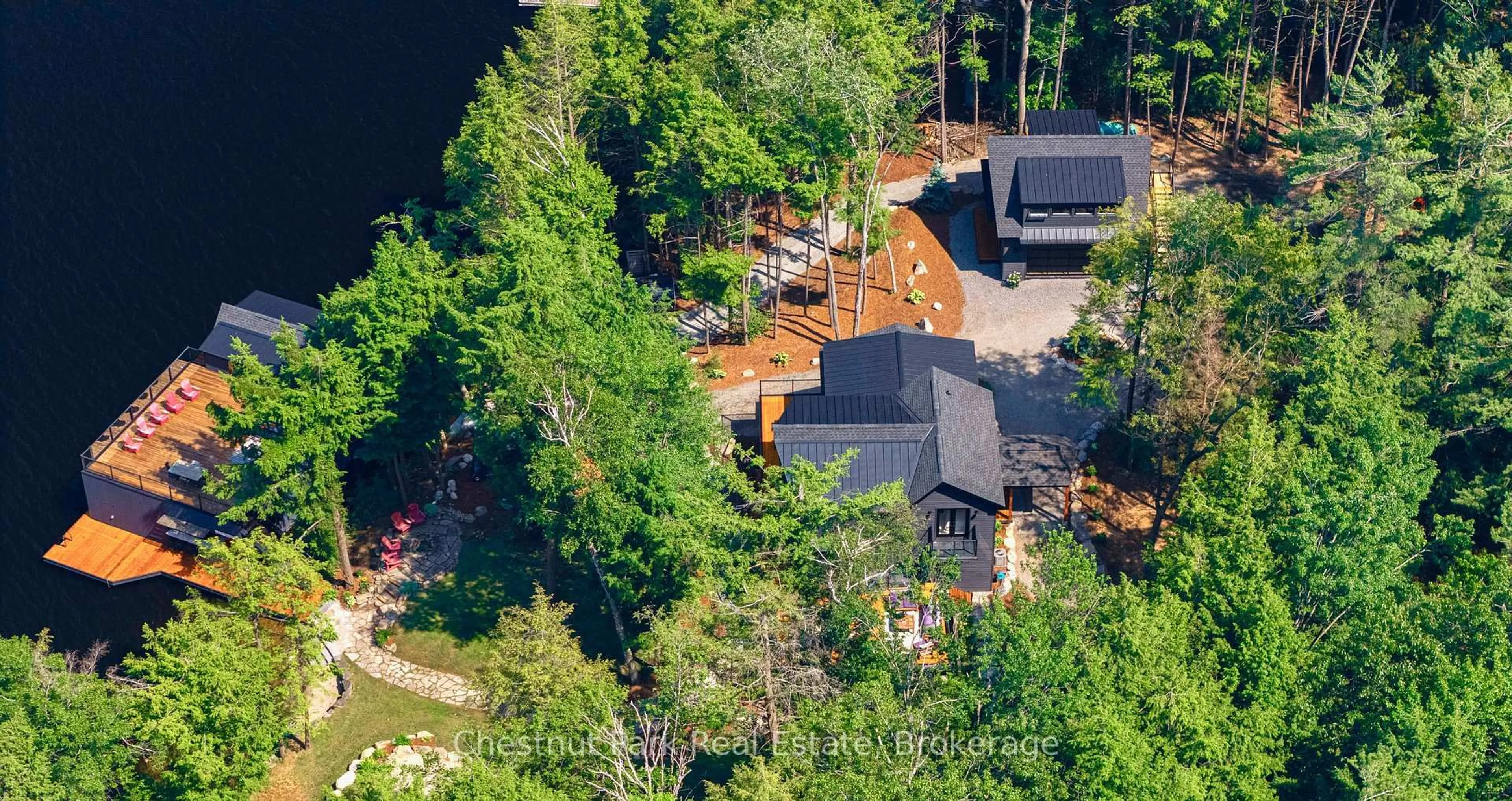 A pic from outside/outdoor area/front of a property/back of a property/a pic from drone, forest/trees view for 6 Taylor Island 26LM, Gravenhurst Ontario P1P 1R2