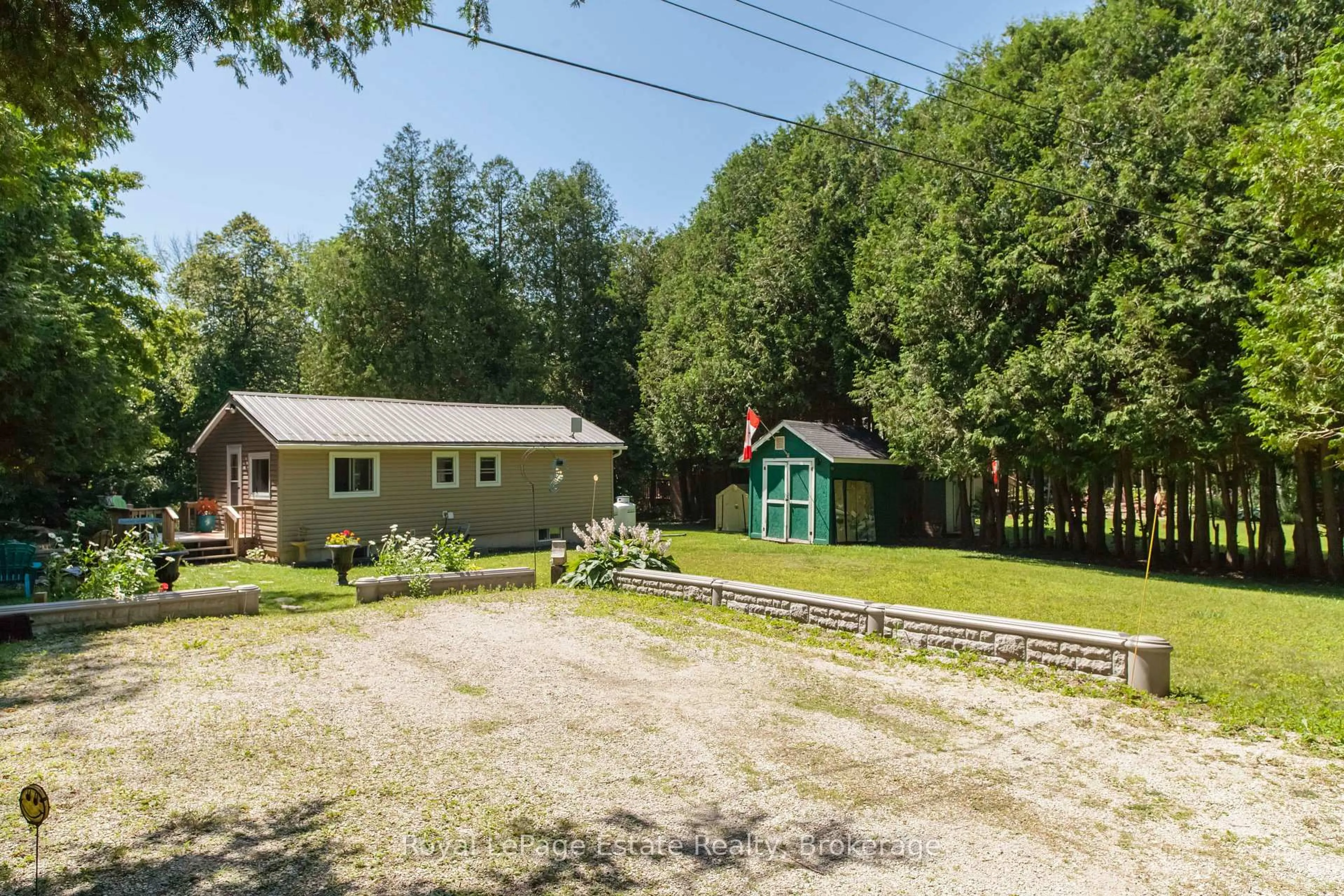 A pic from outside/outdoor area/front of a property/back of a property/a pic from drone, unknown for 50 Roger's Cres, South Bruce Peninsula Ontario N0H 1P0