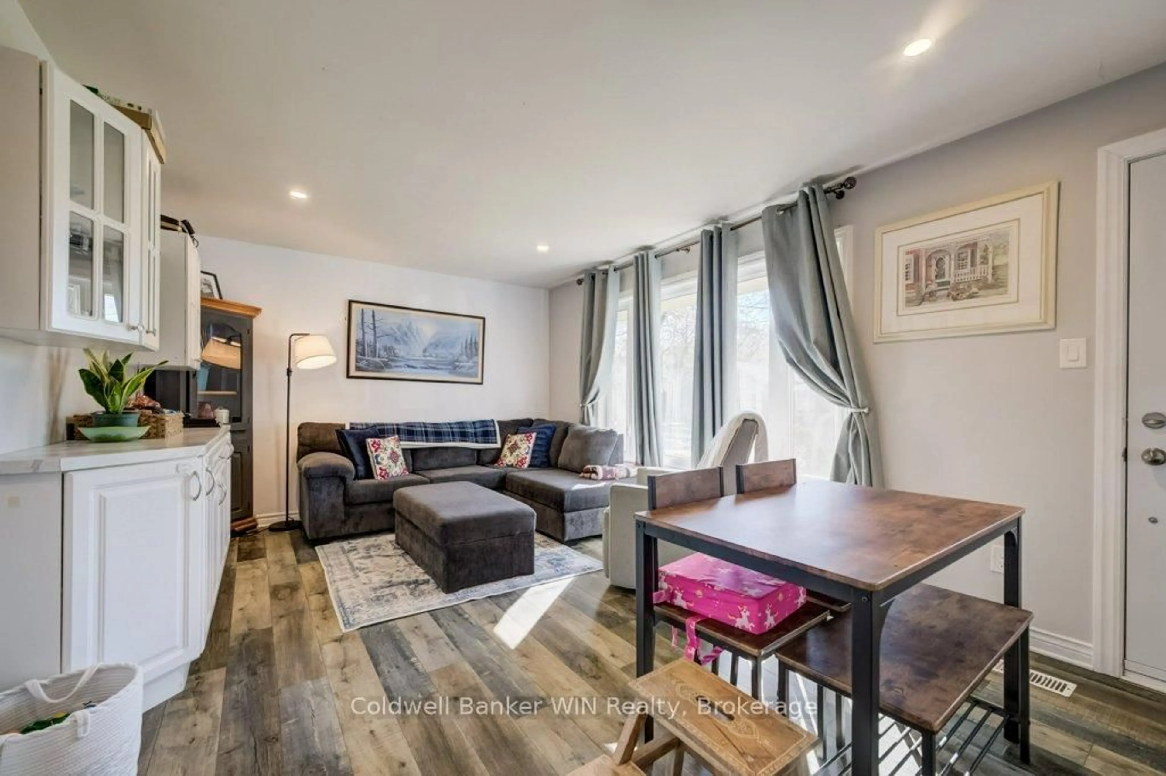 Living room with furniture, wood/laminate floor for 259 Birmingham St, Wellington North Ontario N0G 2L2