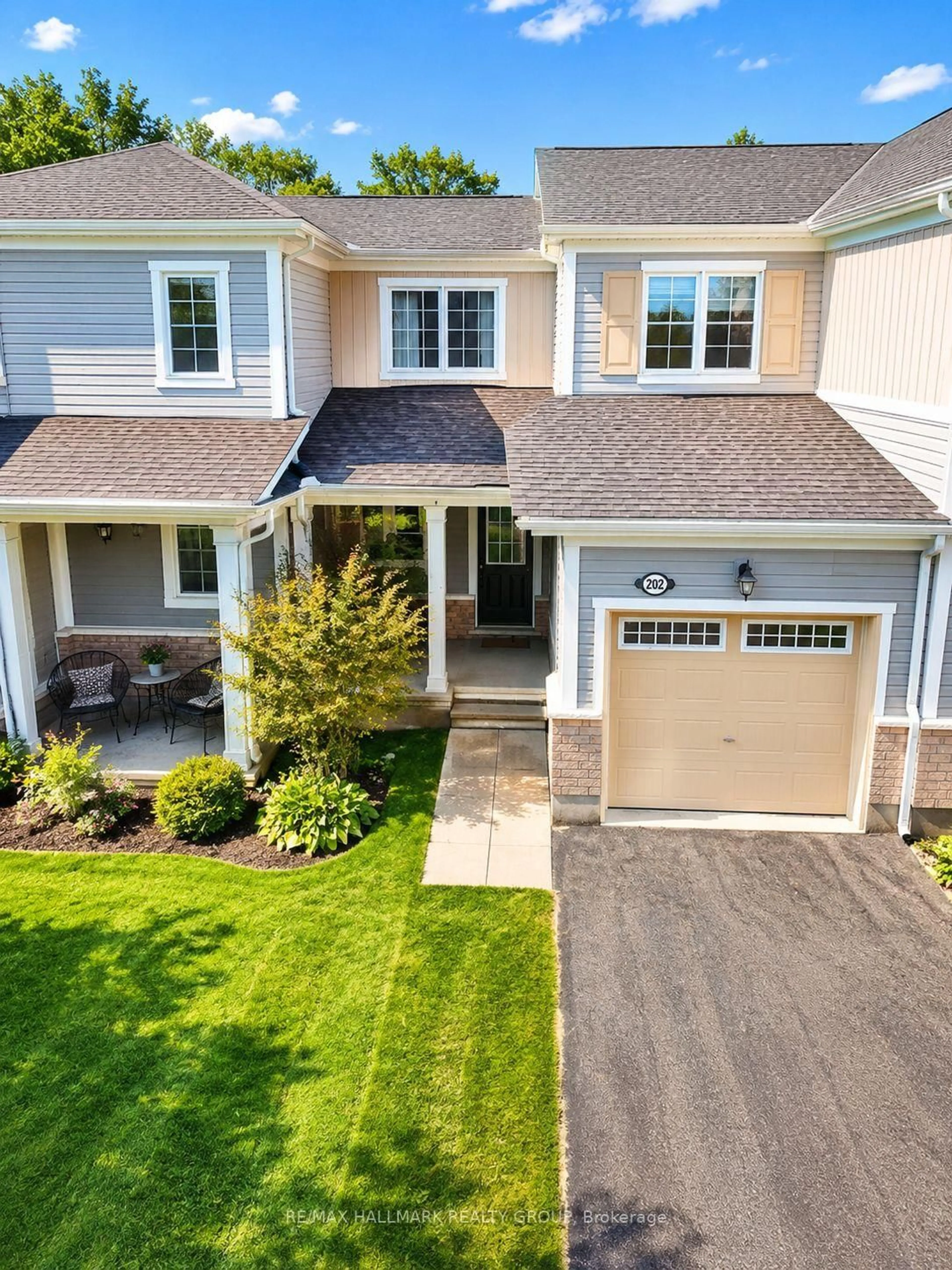 Home with vinyl exterior material, street for 202 Conifer Creek Circ, Ottawa Ontario K2M 0M2