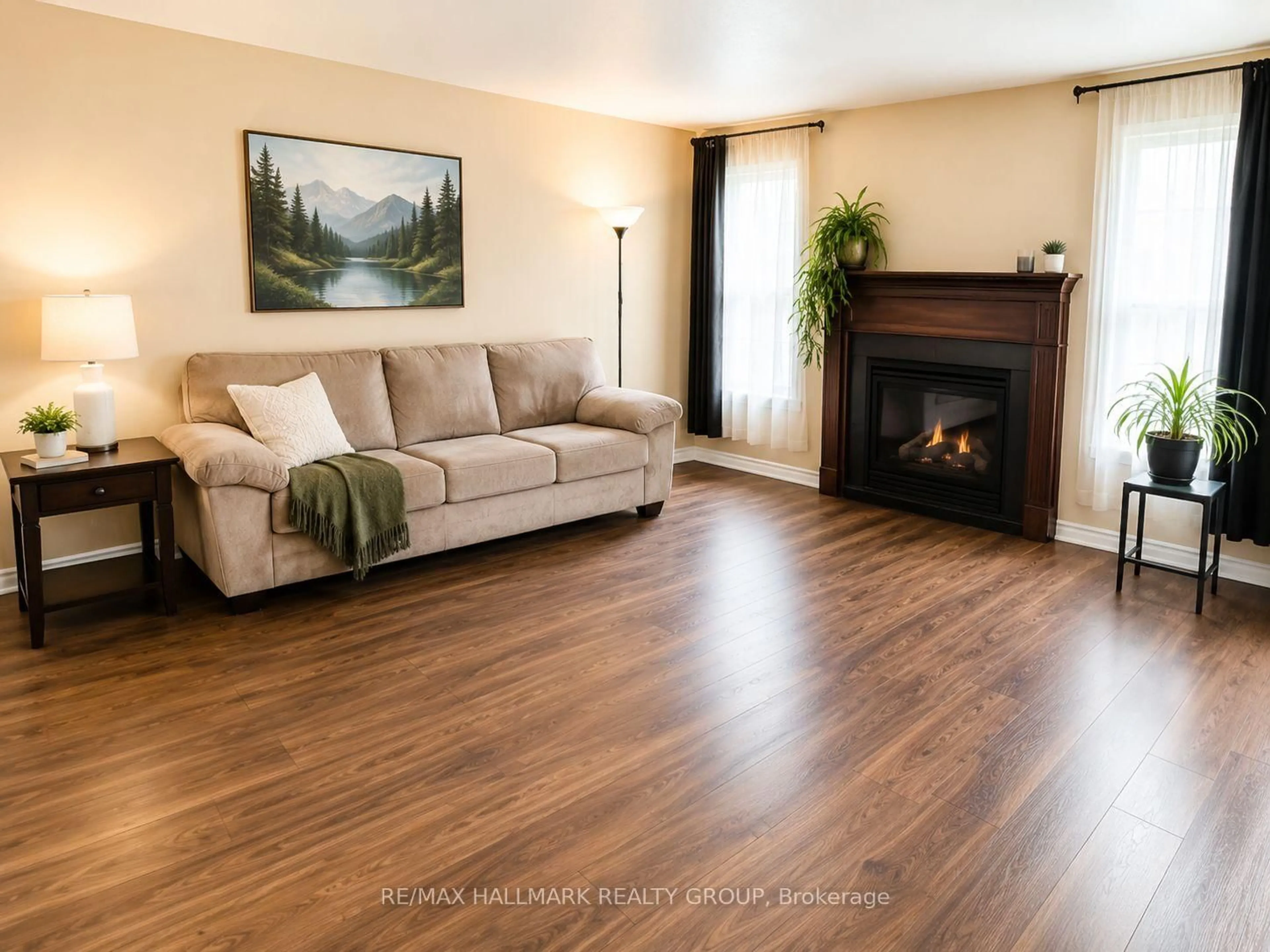Living room with furniture, wood/laminate floor for 202 Conifer Creek Circ, Ottawa Ontario K2M 0M2