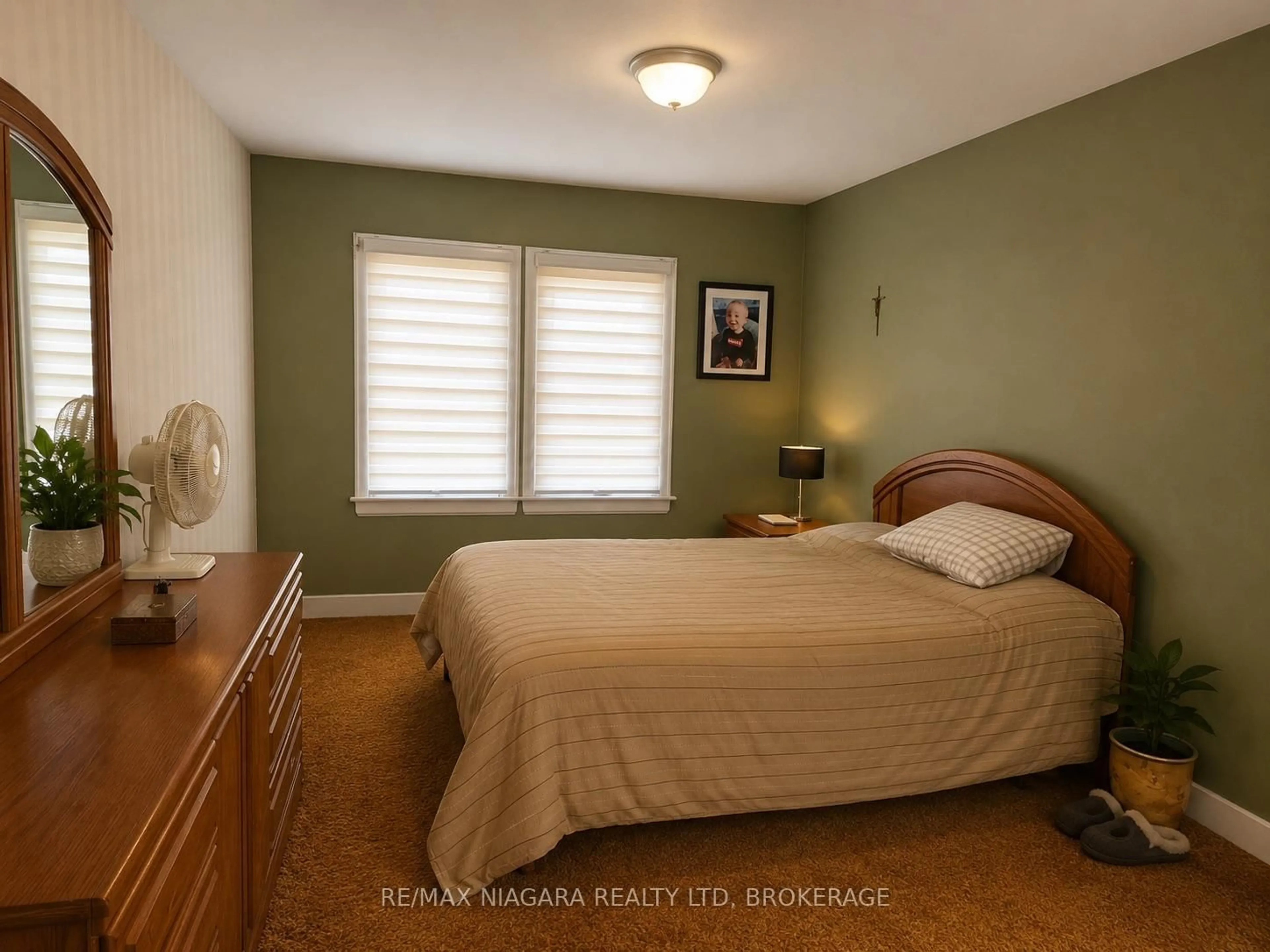 Bedroom with bed, wood/laminate floor for 66 Radford Ave, Fort Erie Ontario L2A 5H8