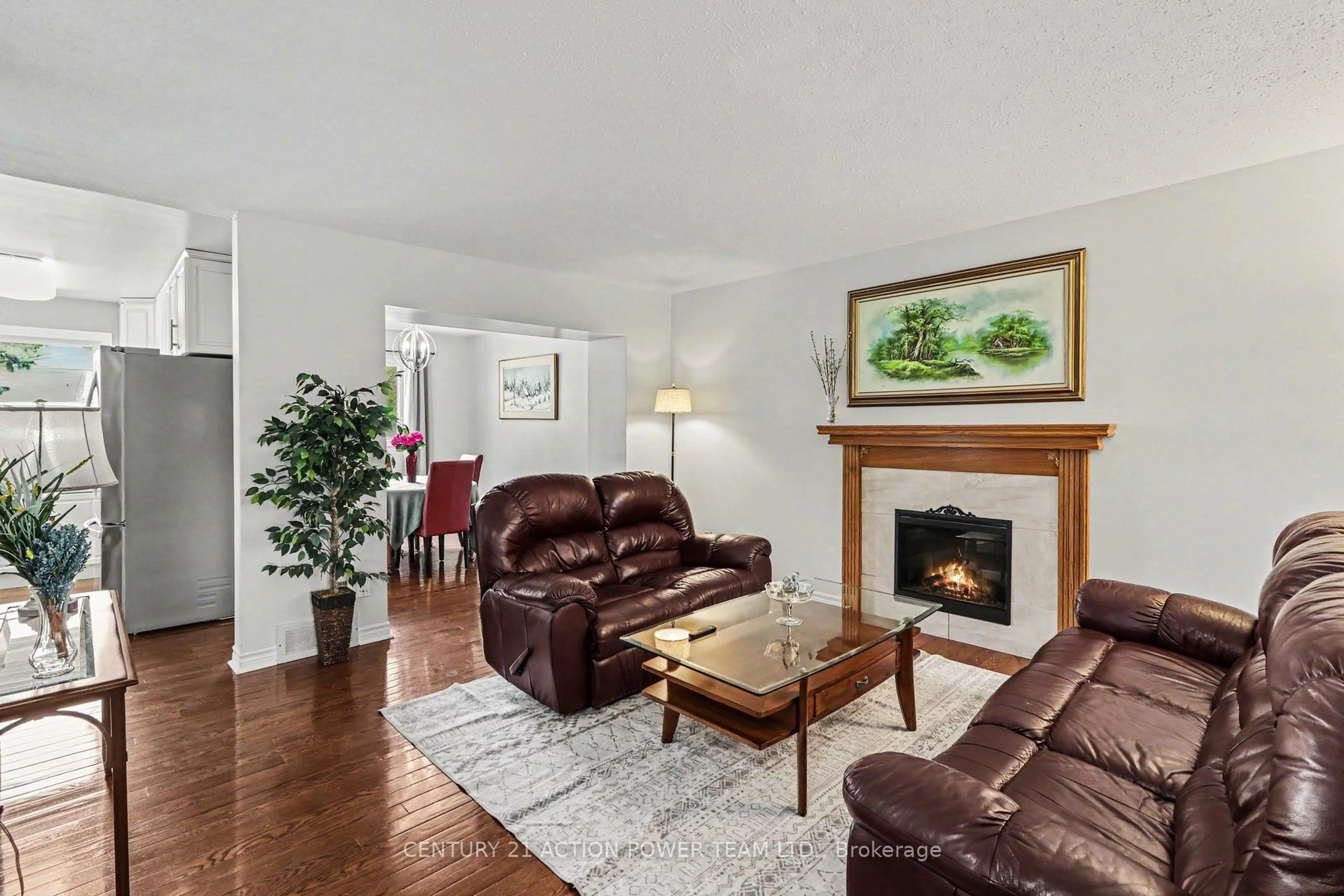 Living room with furniture, wood/laminate floor for 1729 Bottriell Way, Orleans Ontario K4A 1N5