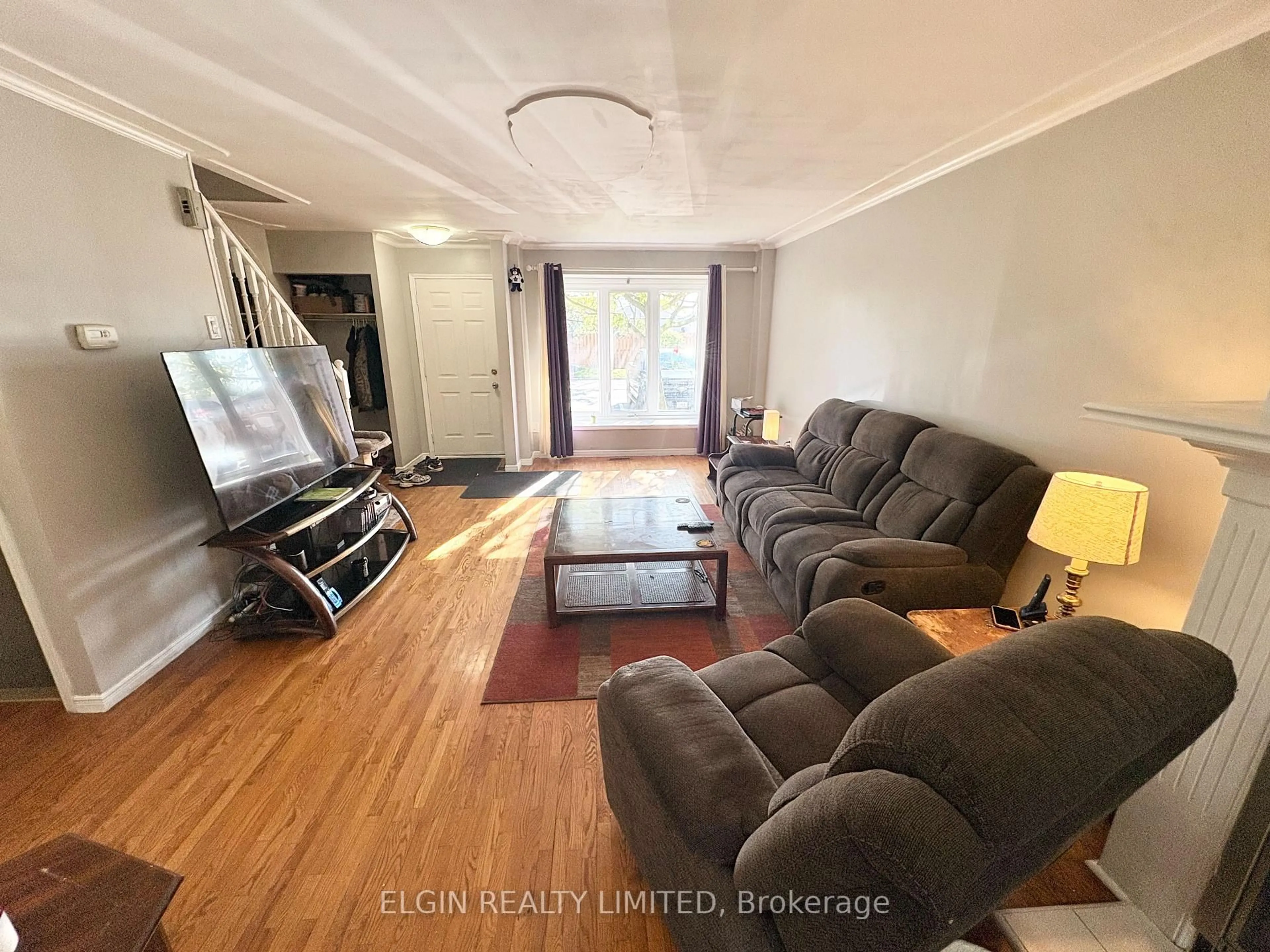 Living room with furniture, wood/laminate floor for 1138 Kipps Lane #5, London East Ontario N5Y 5K6