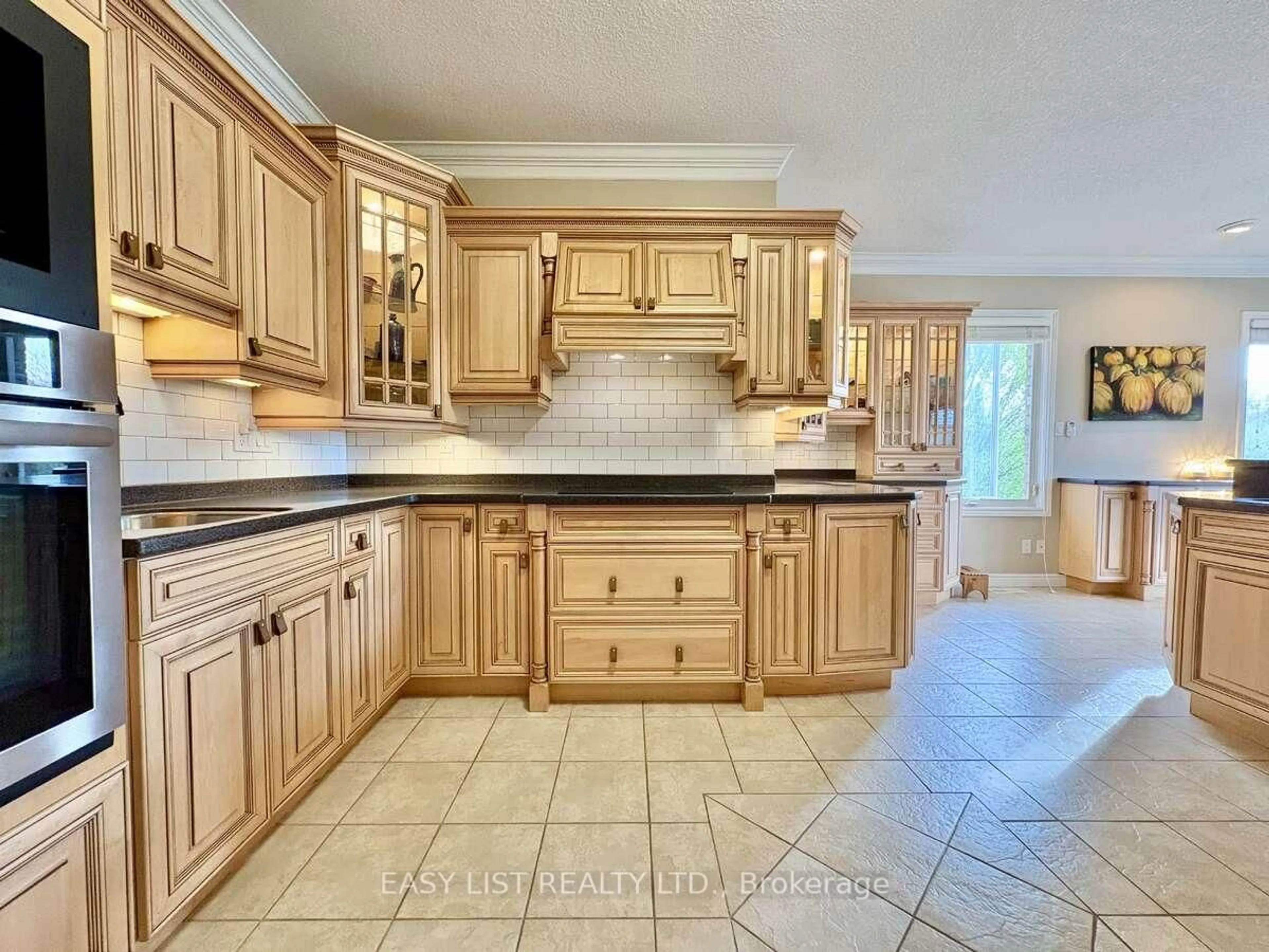 Kitchen with laundary machines, ceramic/tile floor for 1193 Thornley St, London South Ontario N6K 4V5