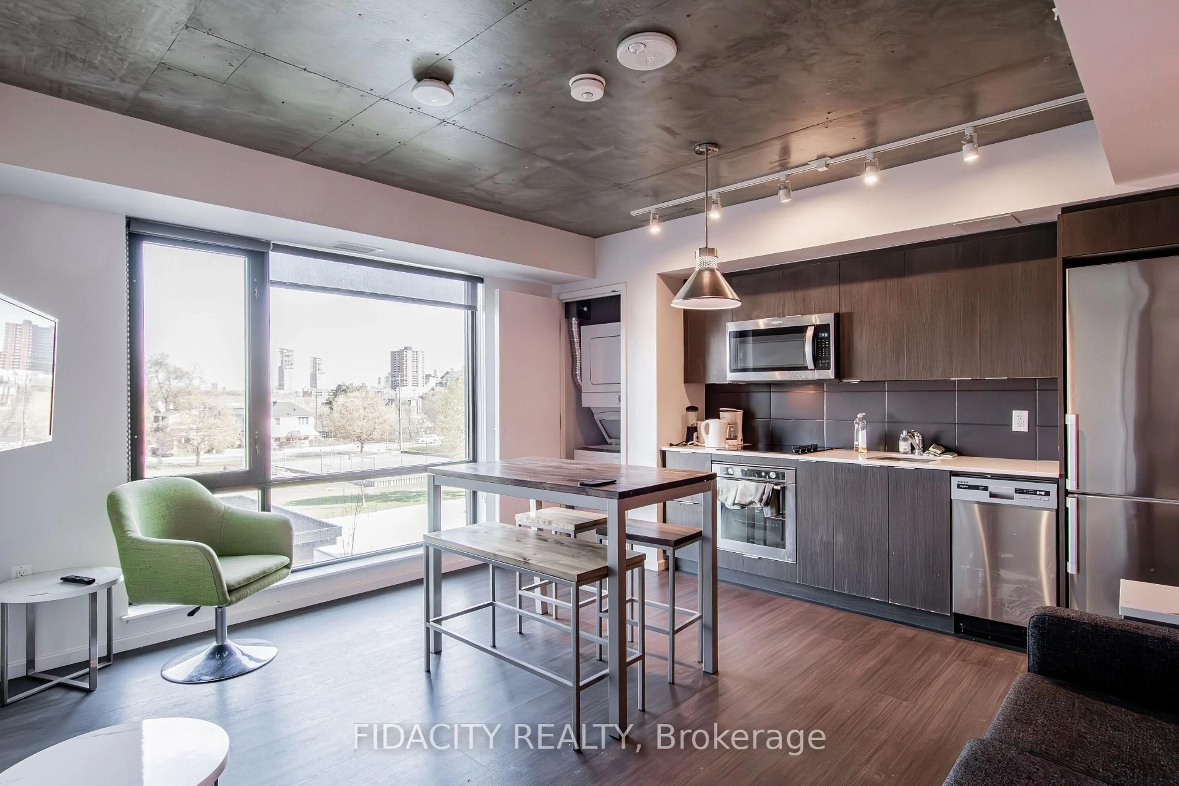 Open concept kitchen, cement floor for 105 Champagne Ave #303, Ottawa Ontario K1S 5E5