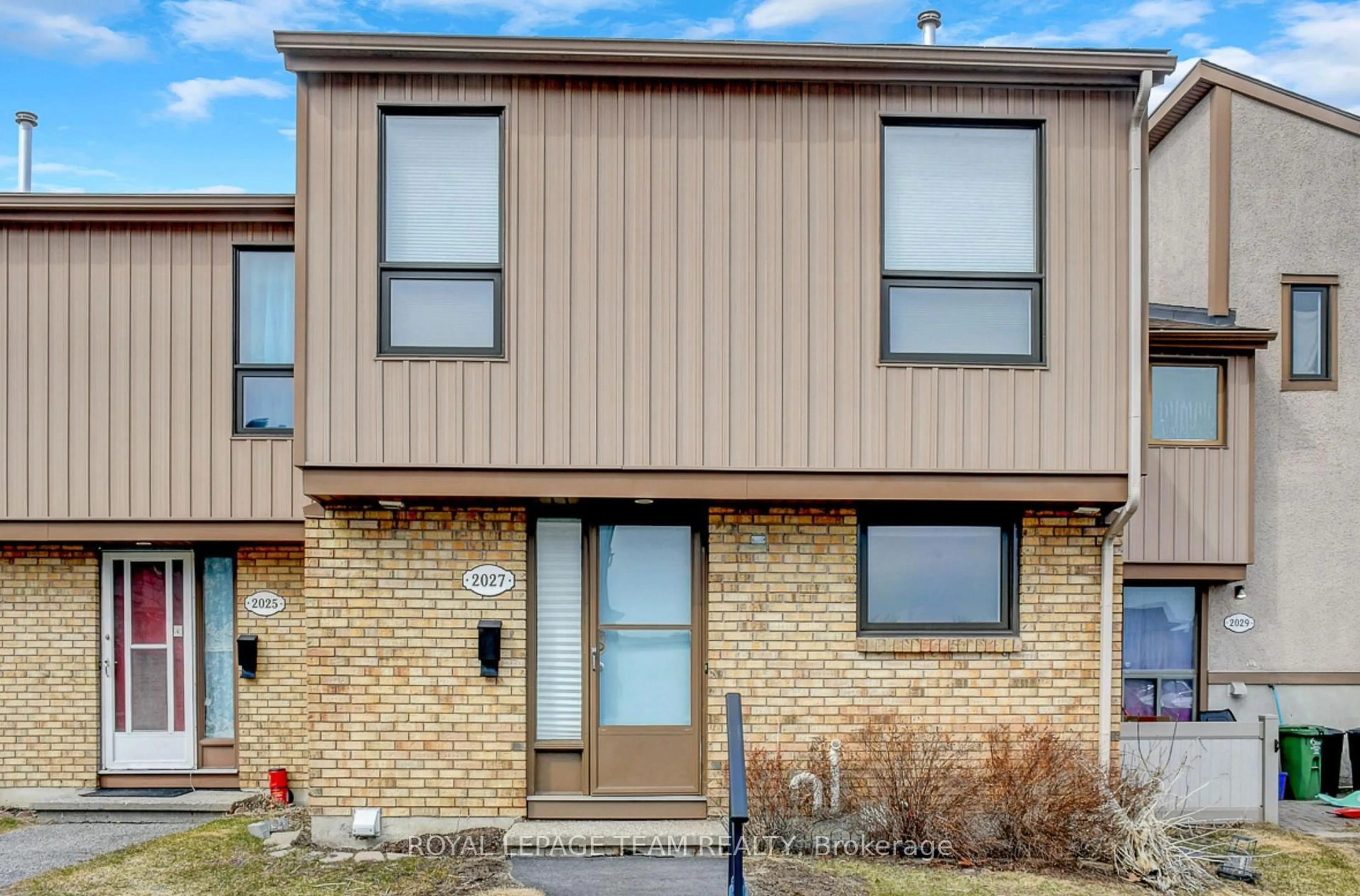 Home with brick exterior material, street for 2027 Stonehenge Cres #35, Ottawa Ontario K1B 4N7