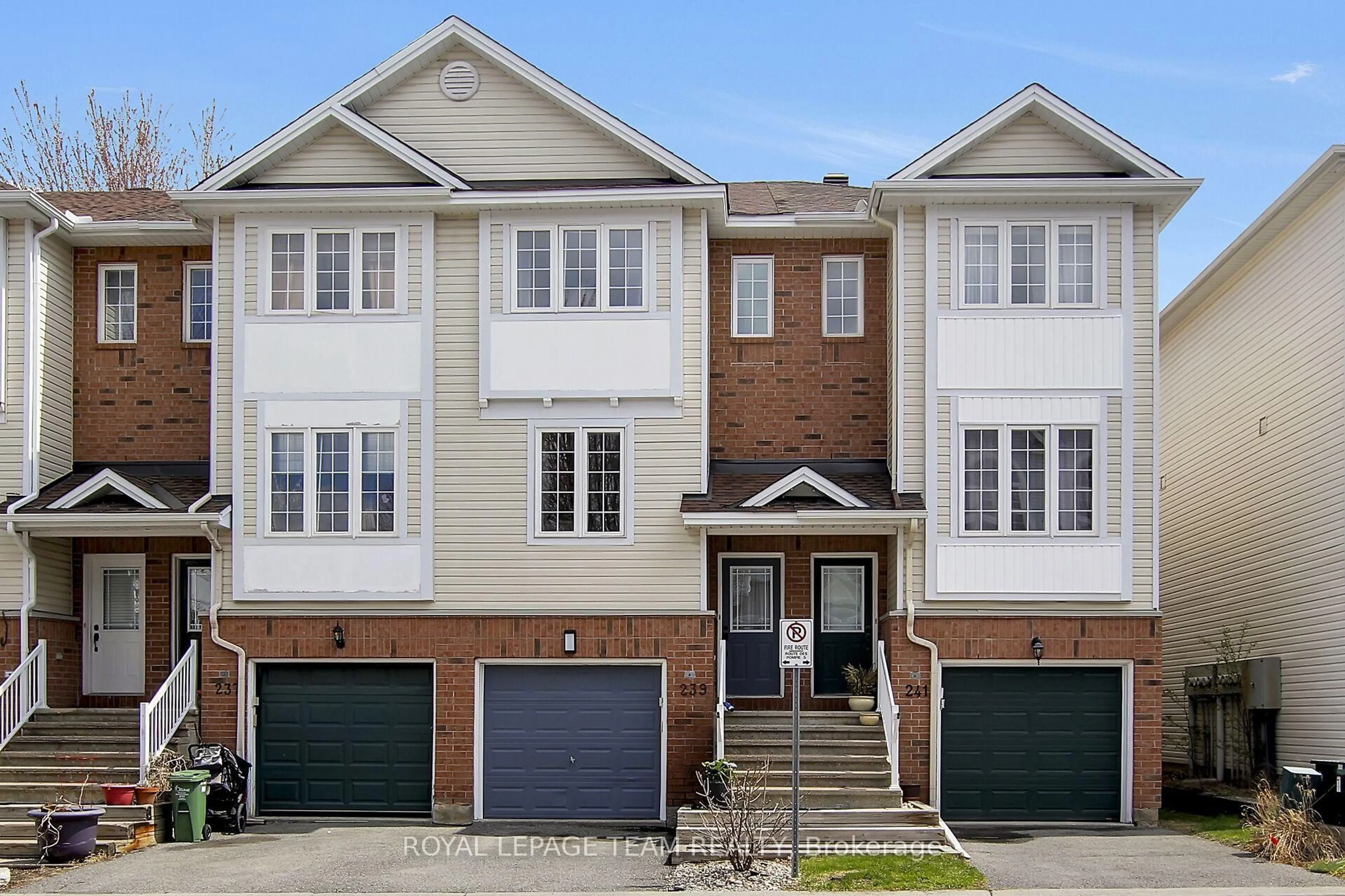 Home with brick exterior material, street for 239 Gershwin Private, Ottawa Ontario K2H 1G6