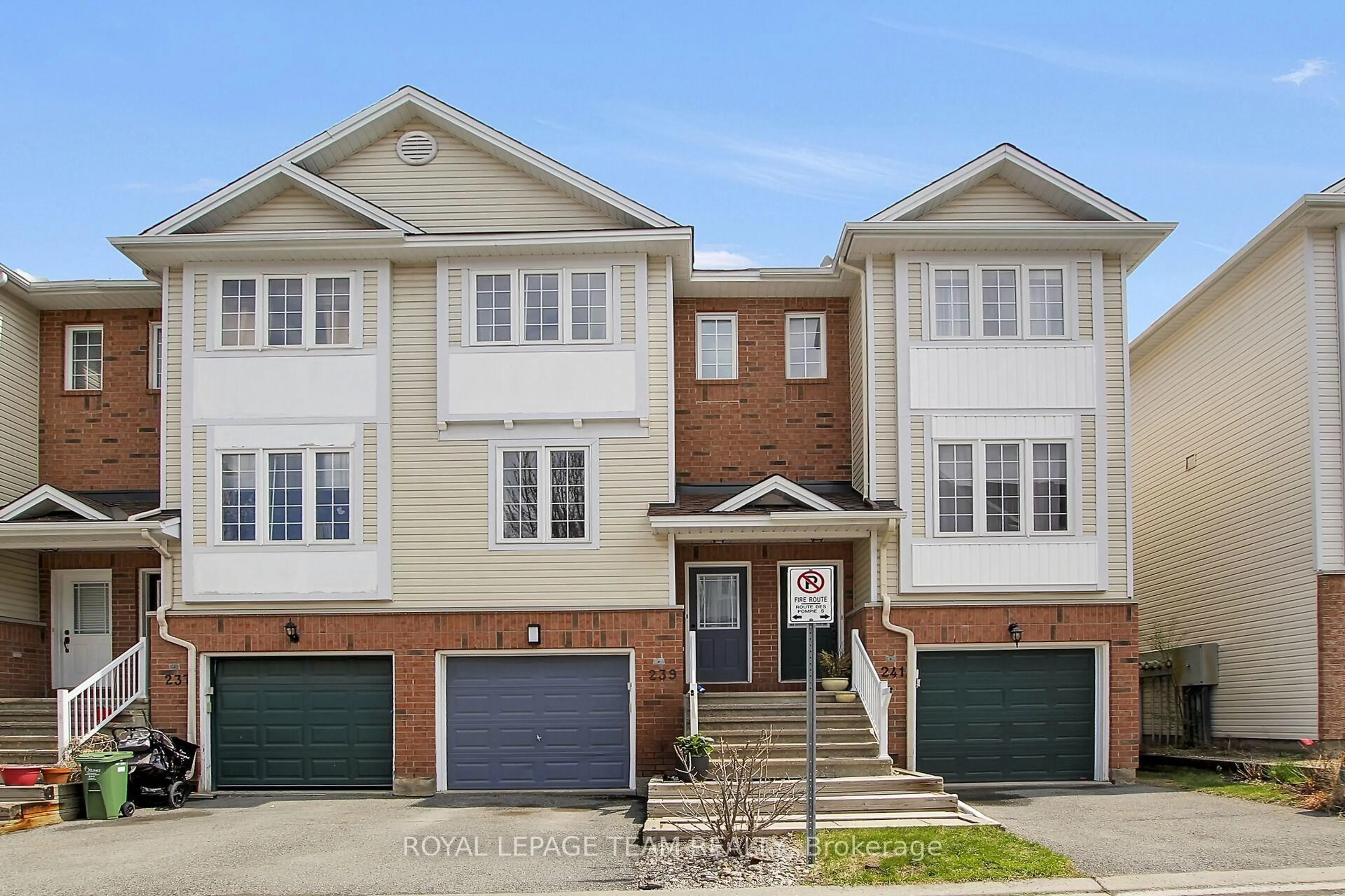Home with brick exterior material, street for 239 Gershwin Private, Ottawa Ontario K2H 1G6