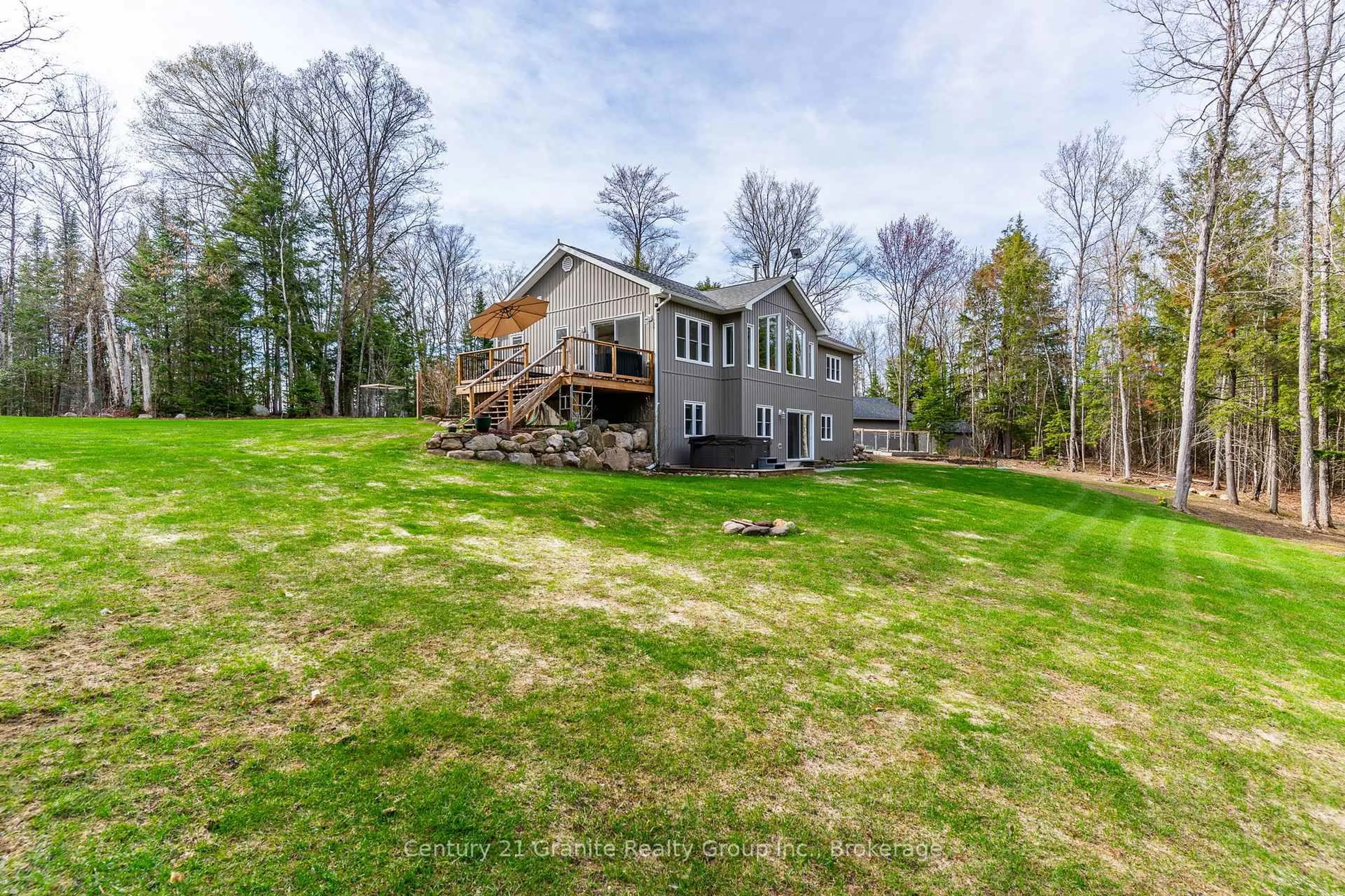 A pic from outside/outdoor area/front of a property/back of a property/a pic from drone, water/lake/river/ocean view for 1208 Eagle Lake Rd, Dysart et al Ontario K0M 1S0