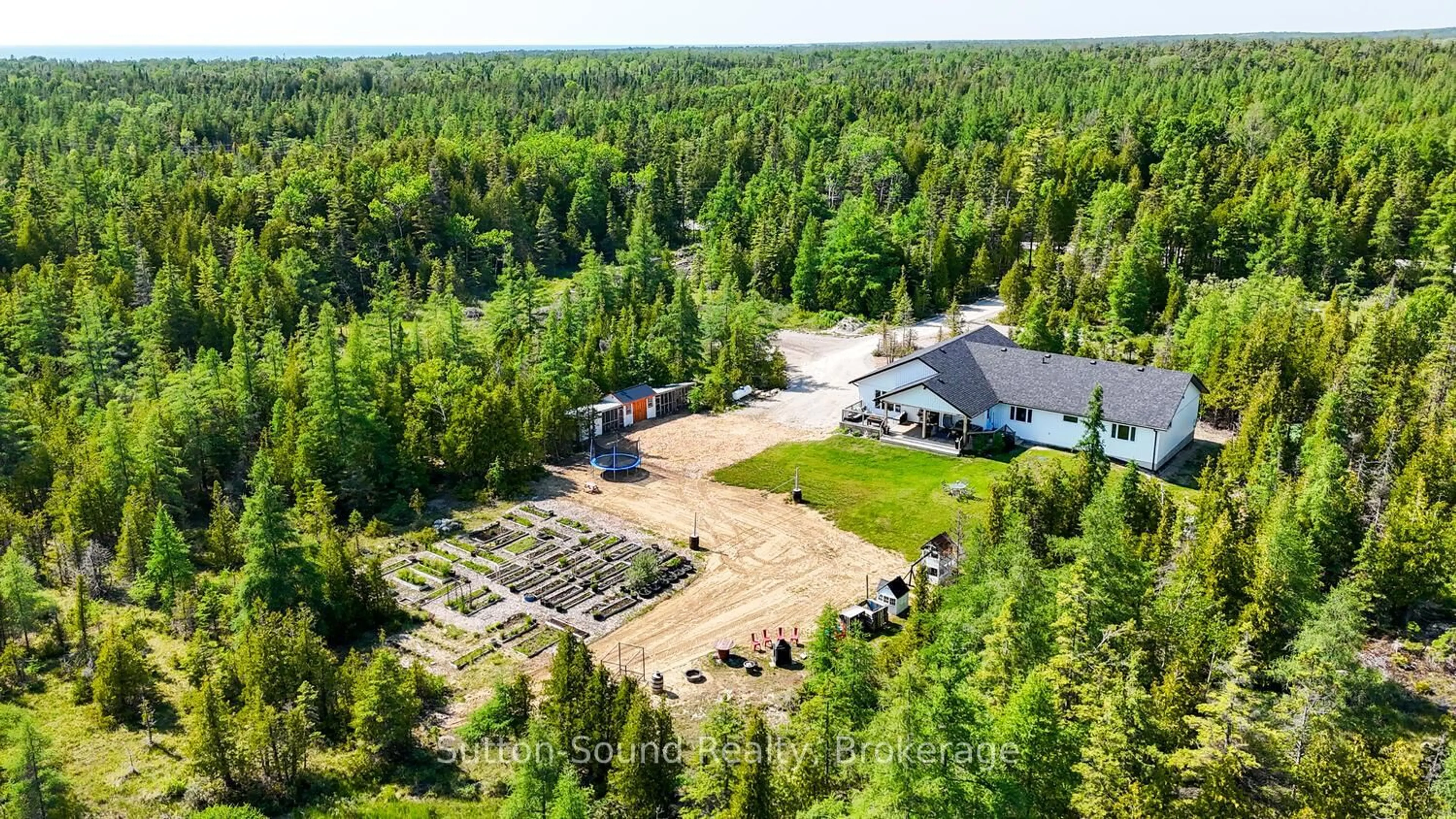 A pic from outside/outdoor area/front of a property/back of a property/a pic from drone, forest/trees view for 107 Whiskey Harbour Rd, Northern Bruce Peninsula Ontario N0H 2T0