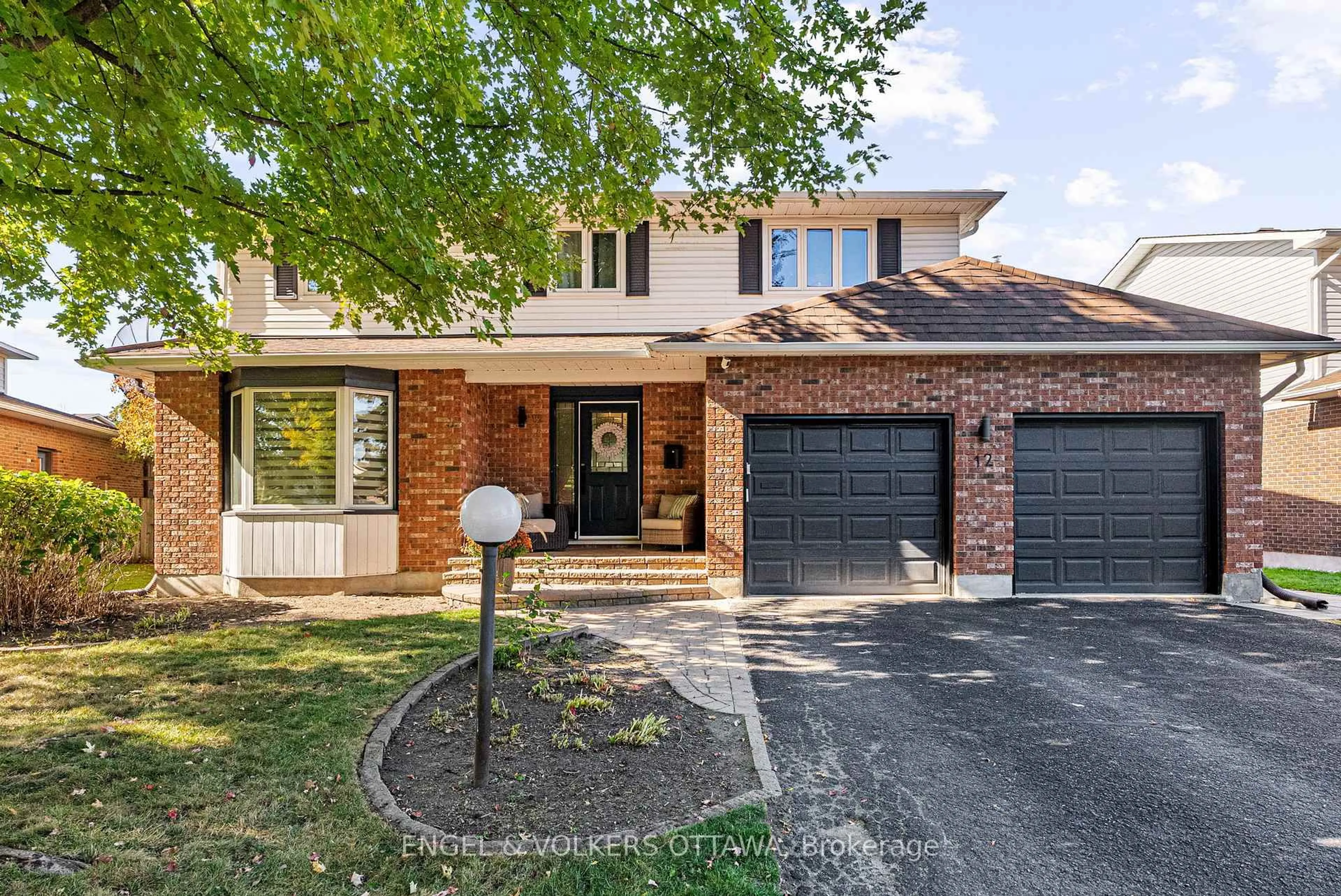 Home with brick exterior material, street for 12 Mancil Dr, Ottawa Ontario K2J 2J5