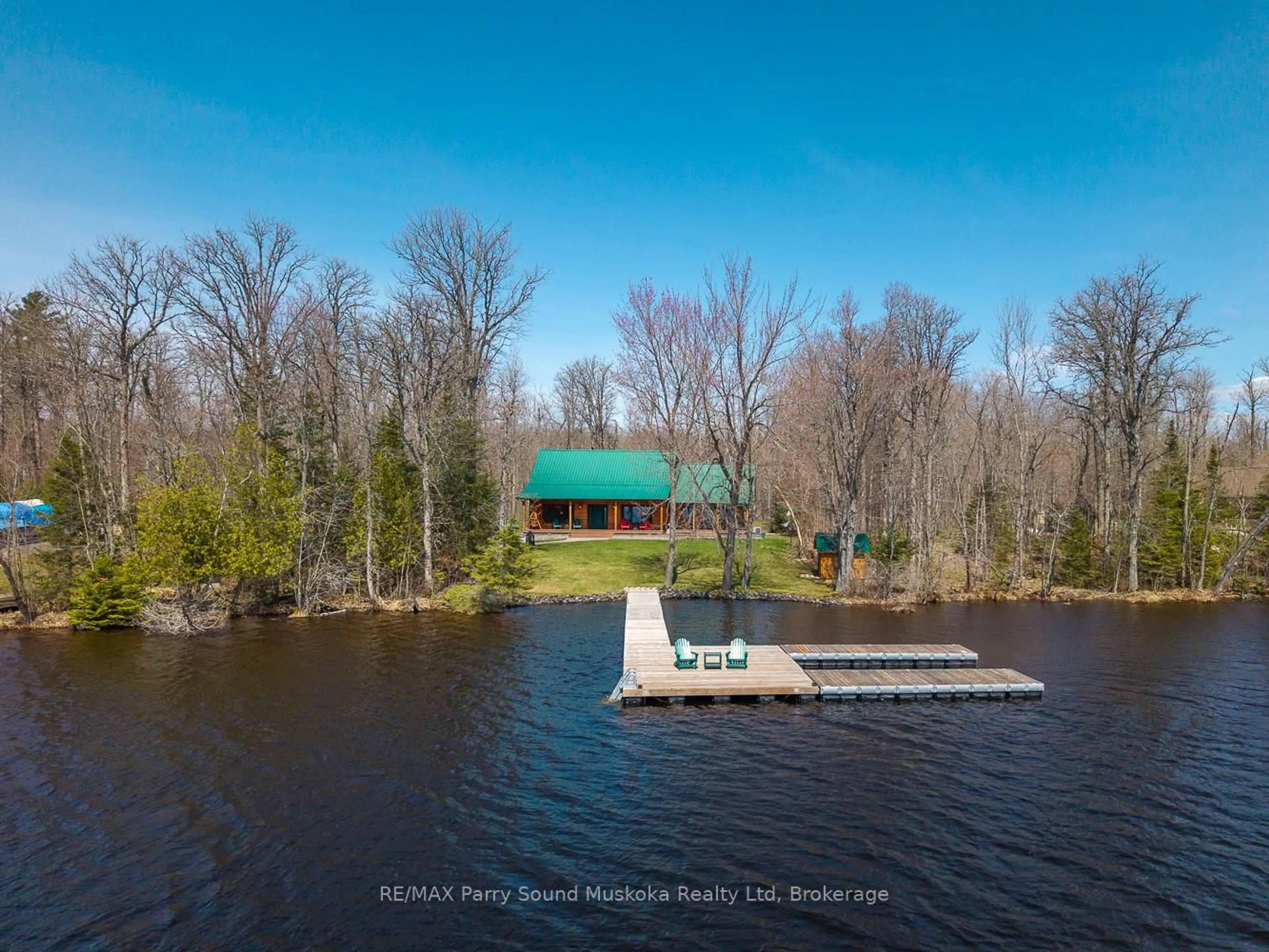 A pic from outside/outdoor area/front of a property/back of a property/a pic from drone, water/lake/river/ocean view for 48 Wendy's Lane, McKellar Ontario P2A 0B5